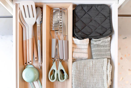 Kitchen utensils organized in a drawer organizer drawer