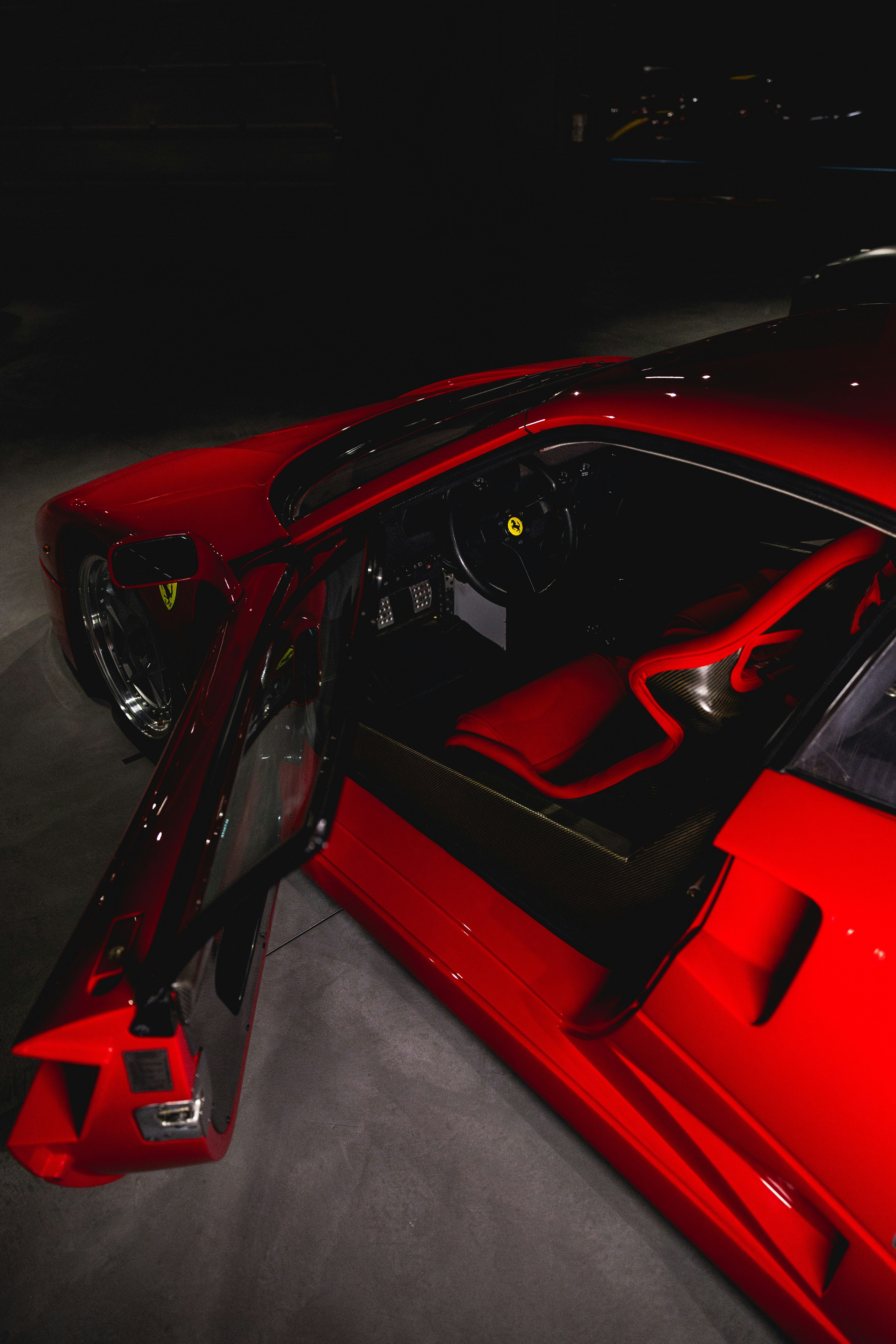 Red sports car interior with open door