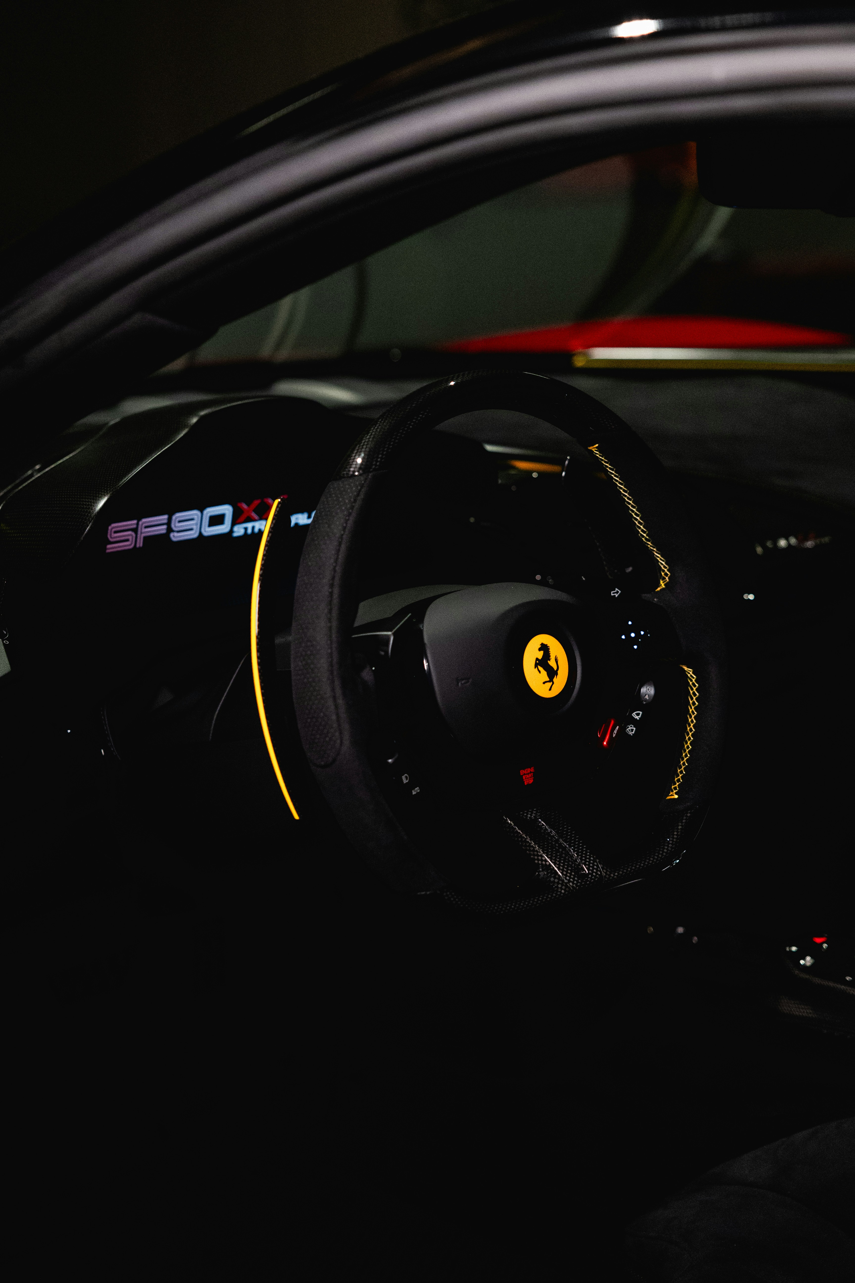 Black ferrari interior with yellow stitching details