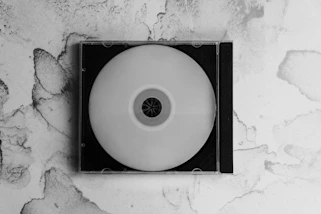 Blank cd in jewel case on marbled background