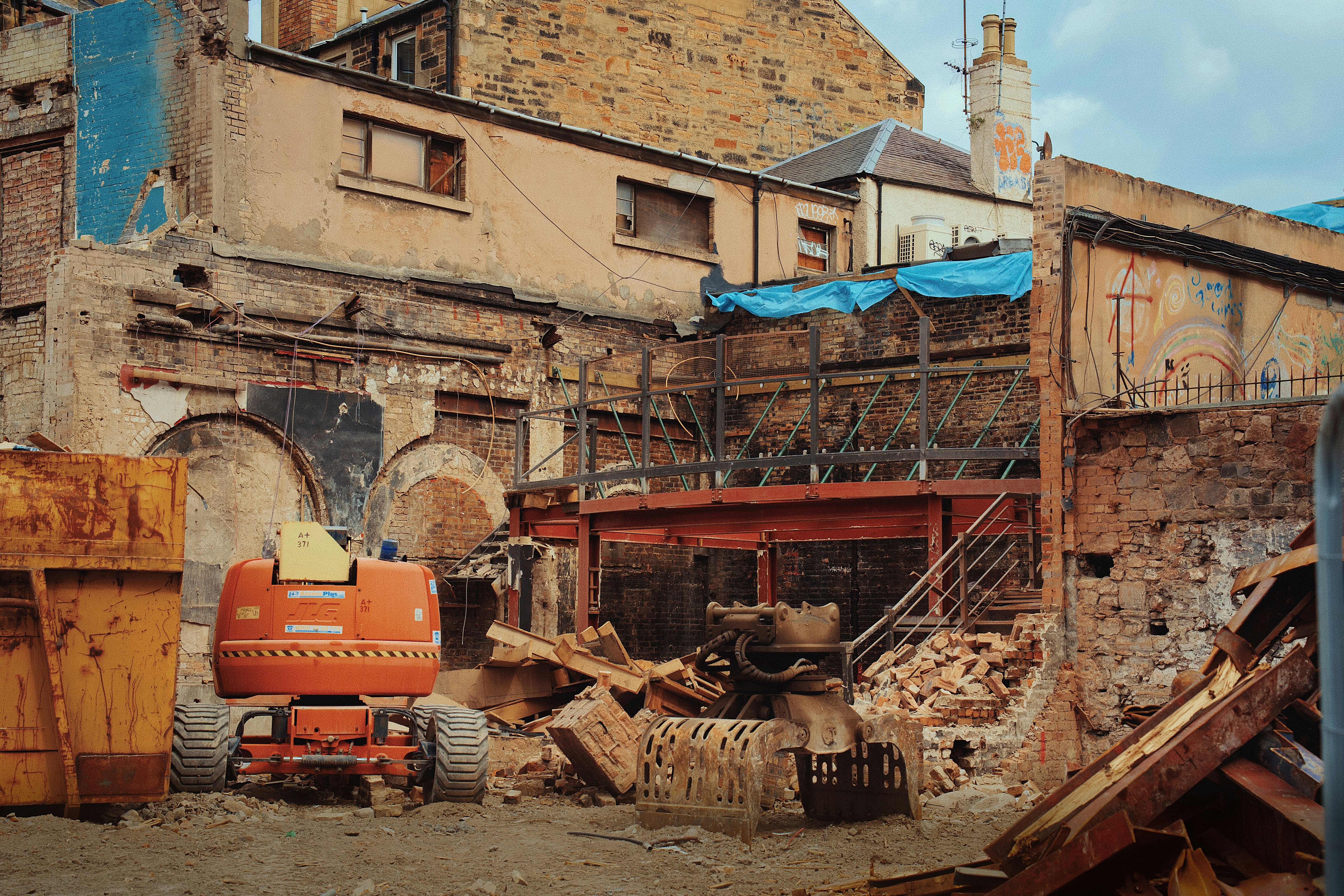 Construction site with excavator and debris