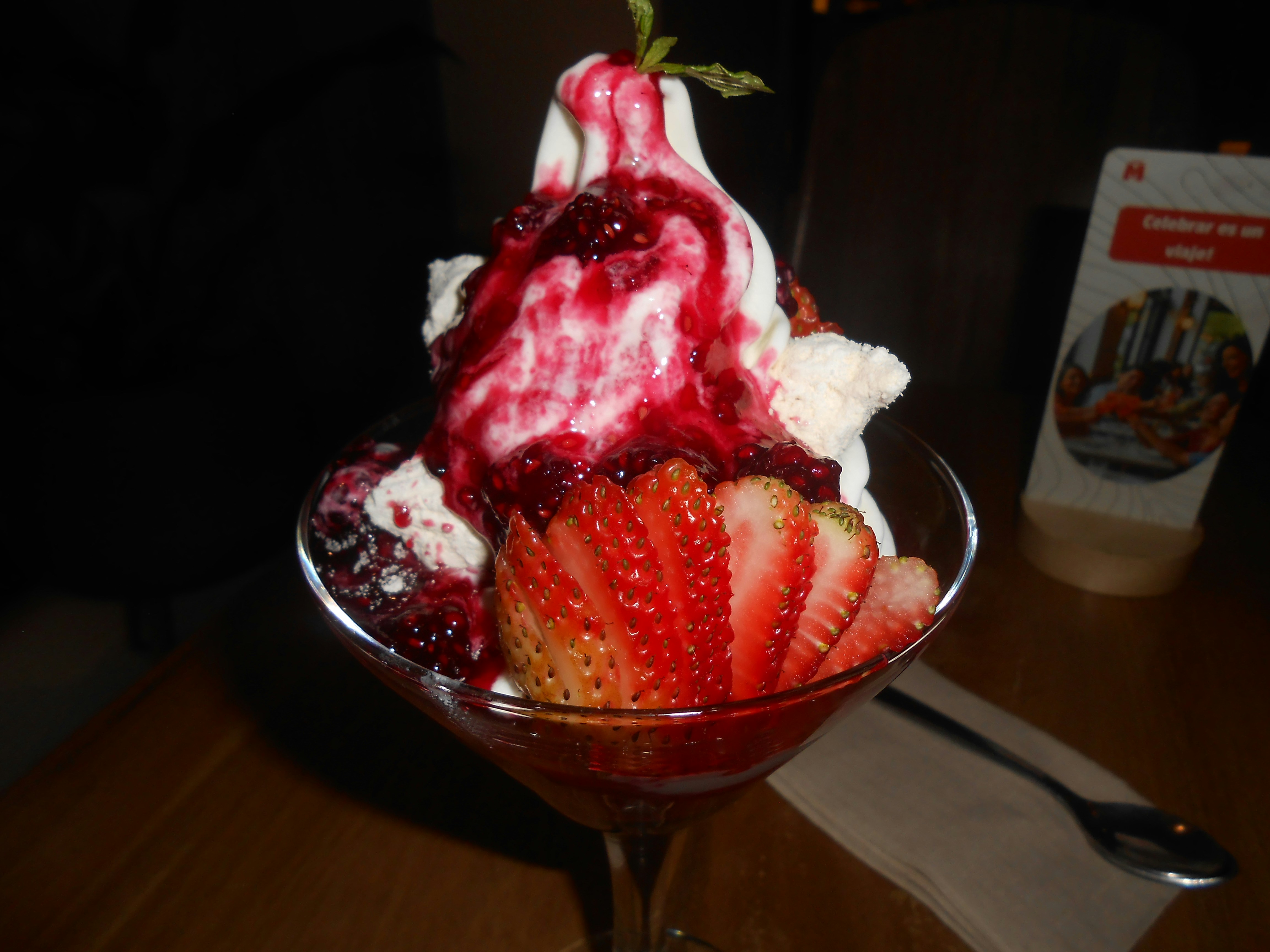 Dessert parfait with strawberries and berry sauce