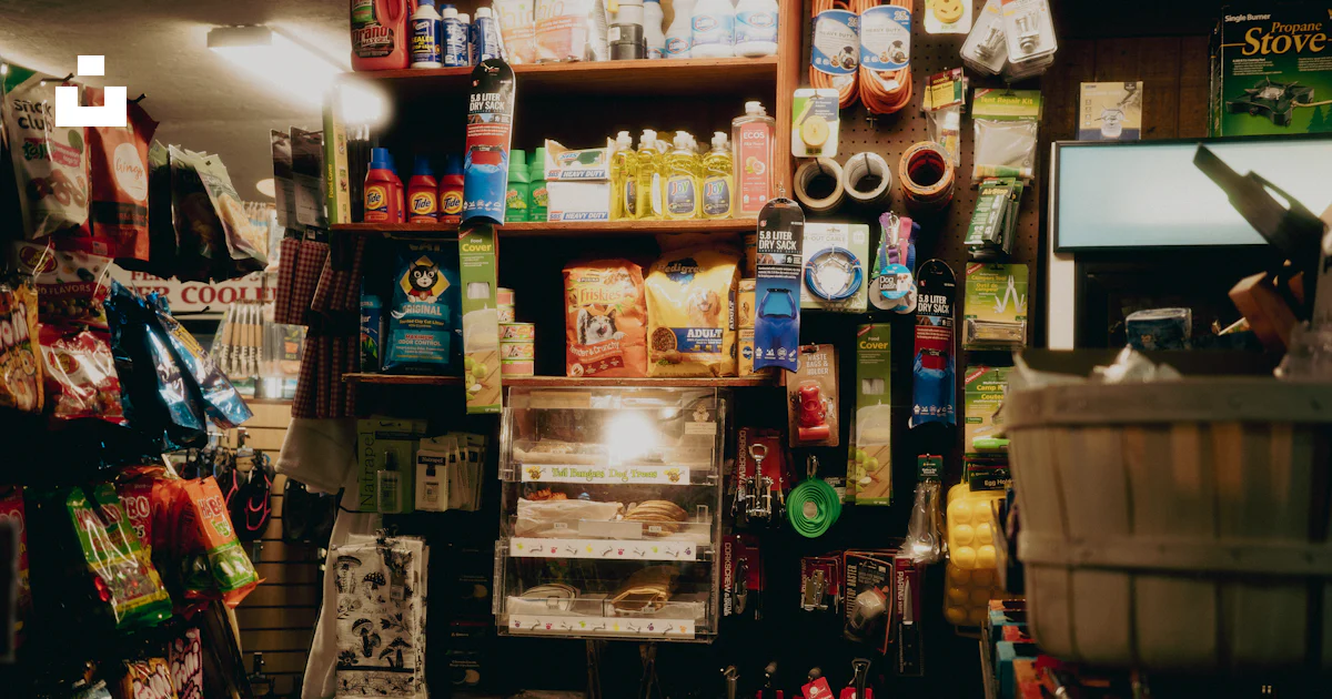 Cluttered Store Ad Example A cluttered convenience store aisle with shelves of goods. photo – Free ...