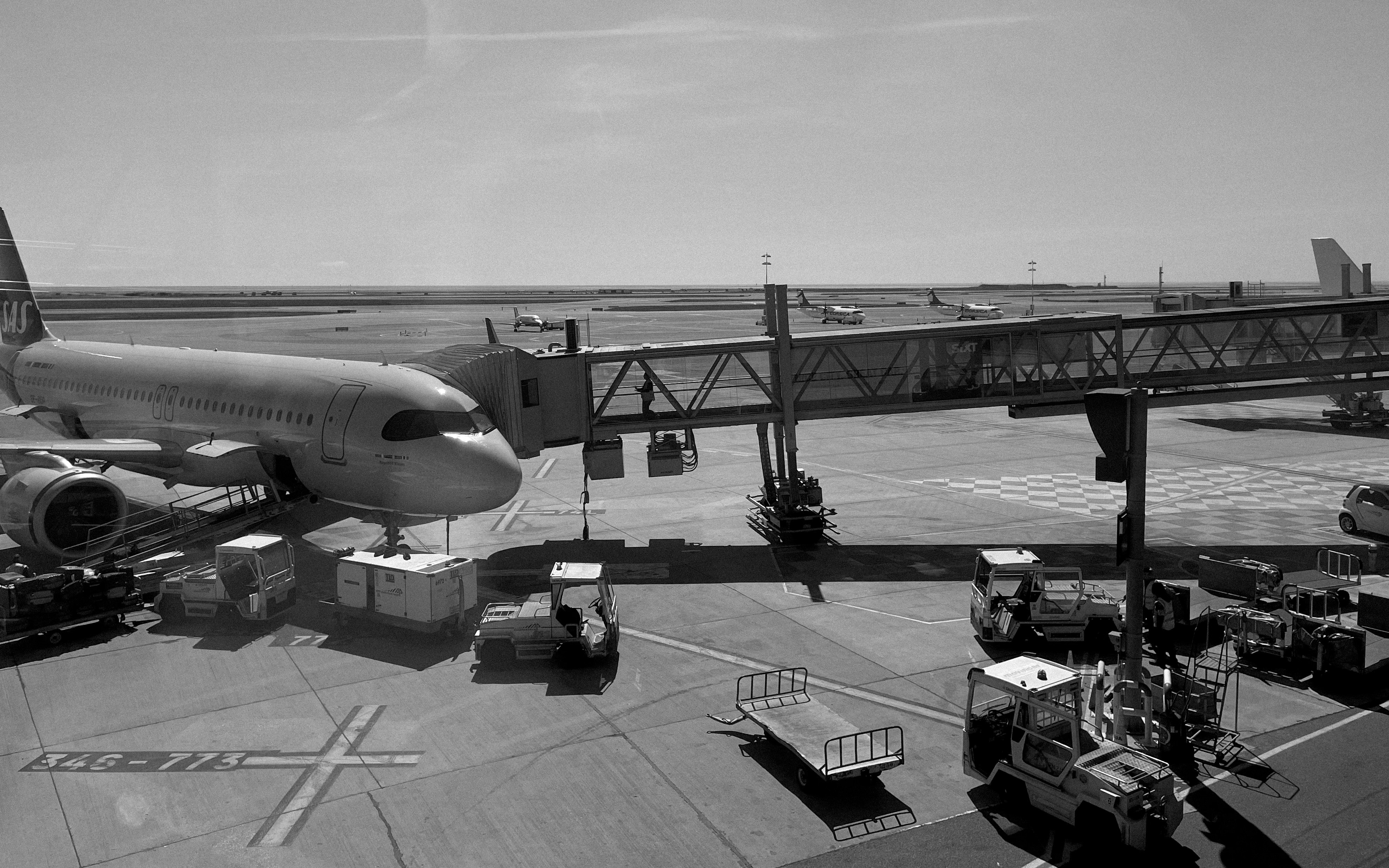 Airplane connected to a jet bridge at an airport