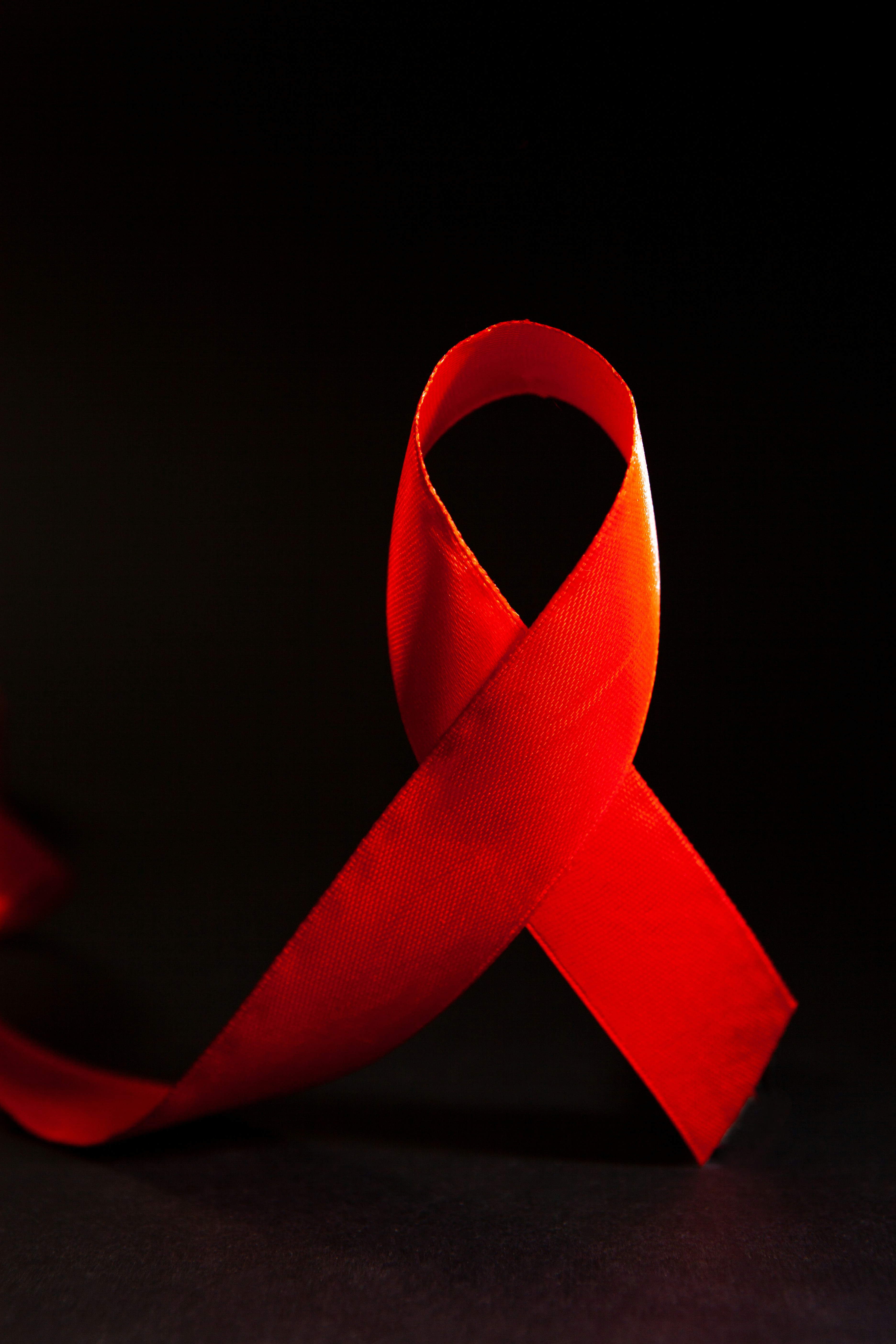 A red ribbon on a black background.