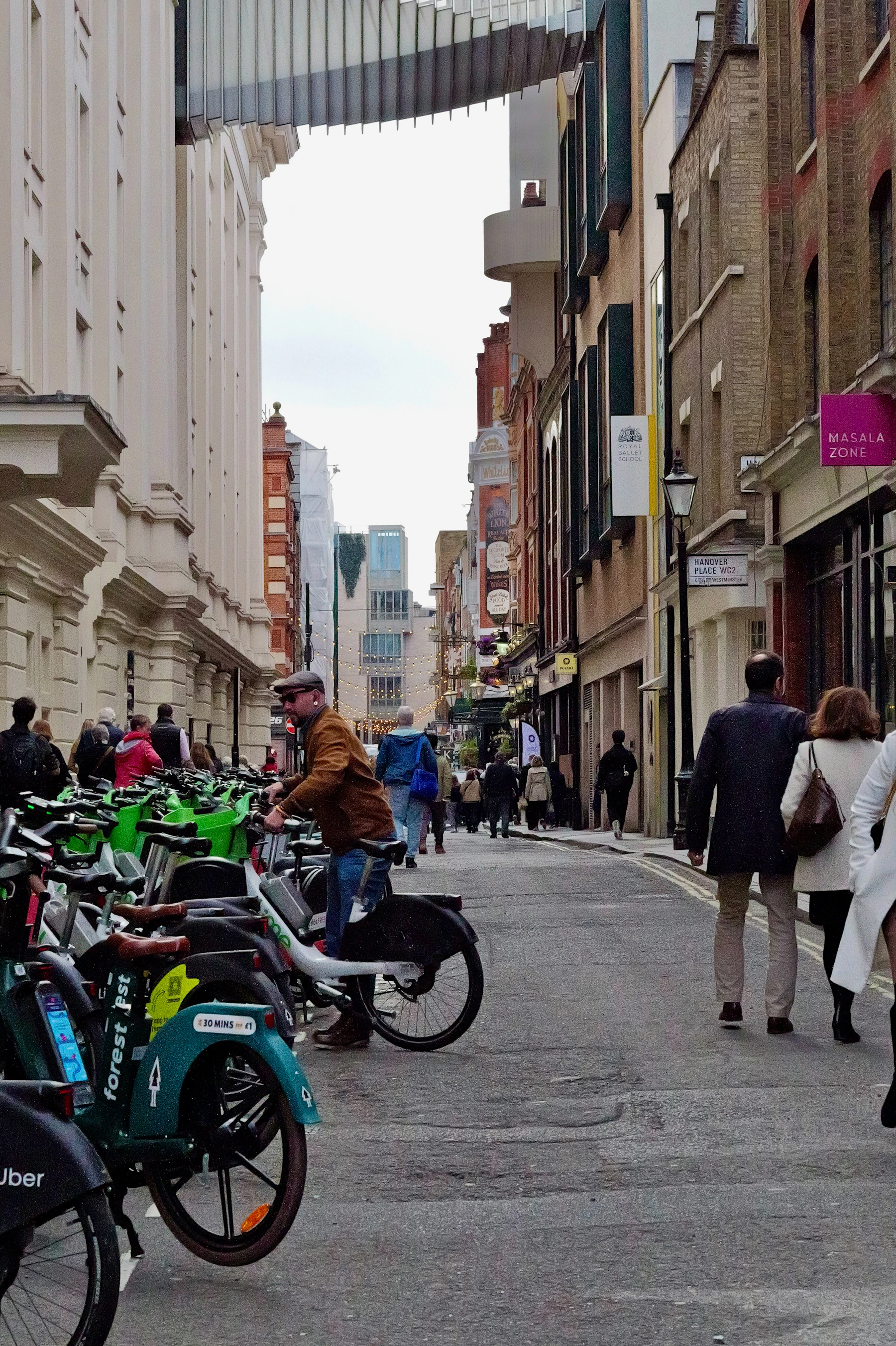 Electric scooter rider in a busy American city showing the importance of state and city specific electric scooter traffic laws