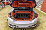 Custom car trunk with subwoofers and orange interior