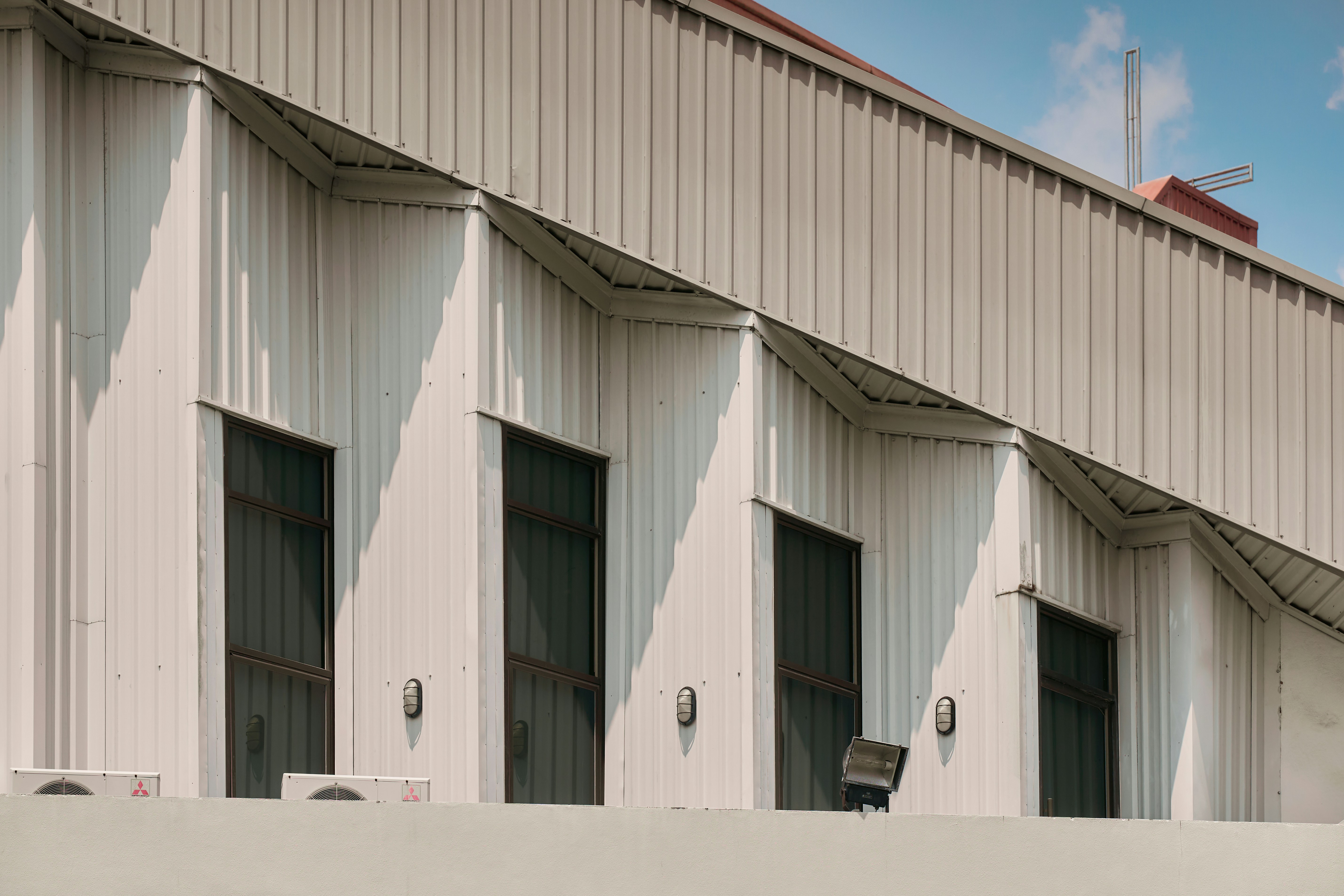 Modern building facade with geometric angles and windows