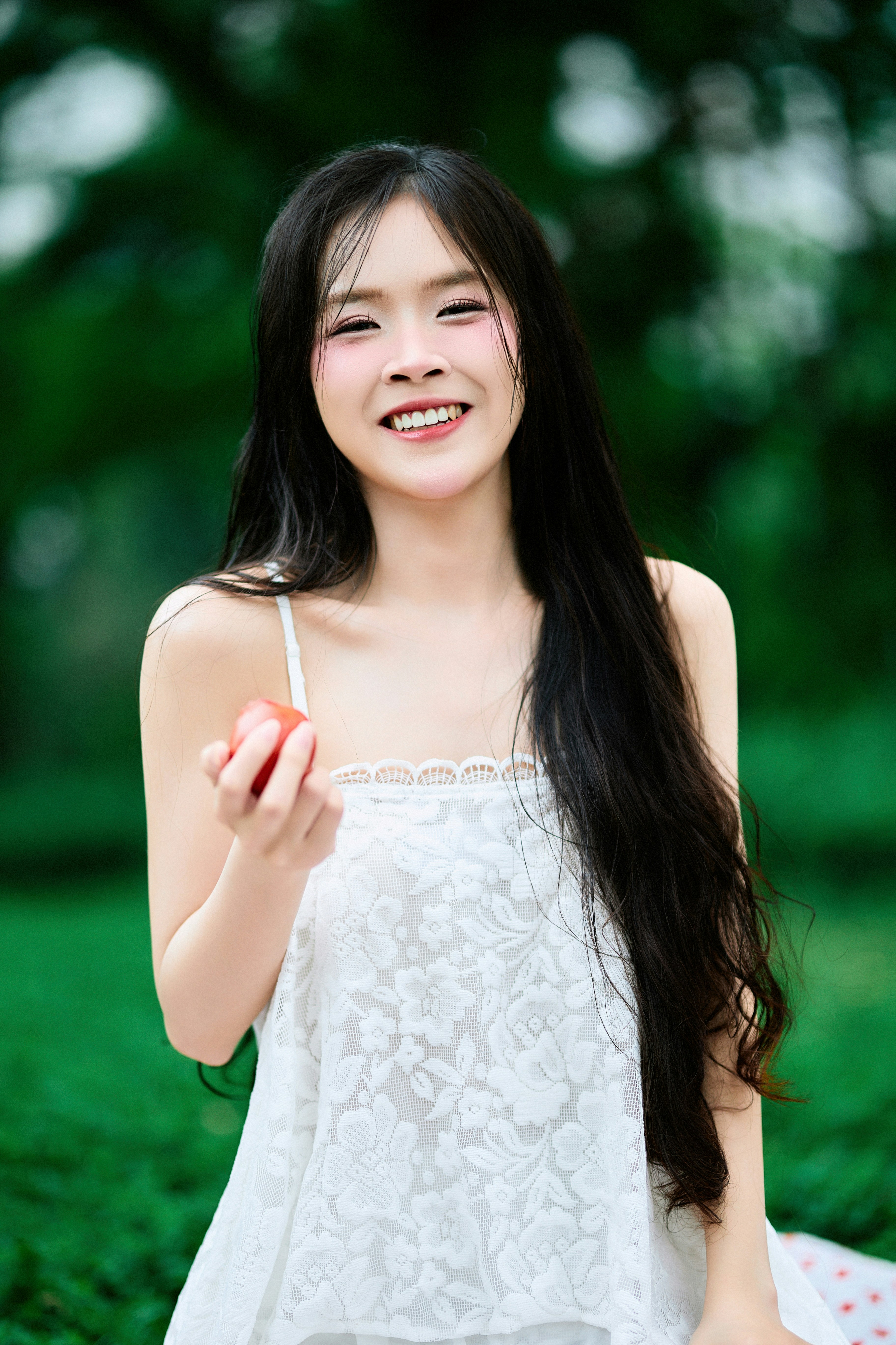 A girl with tomatoes in the forest