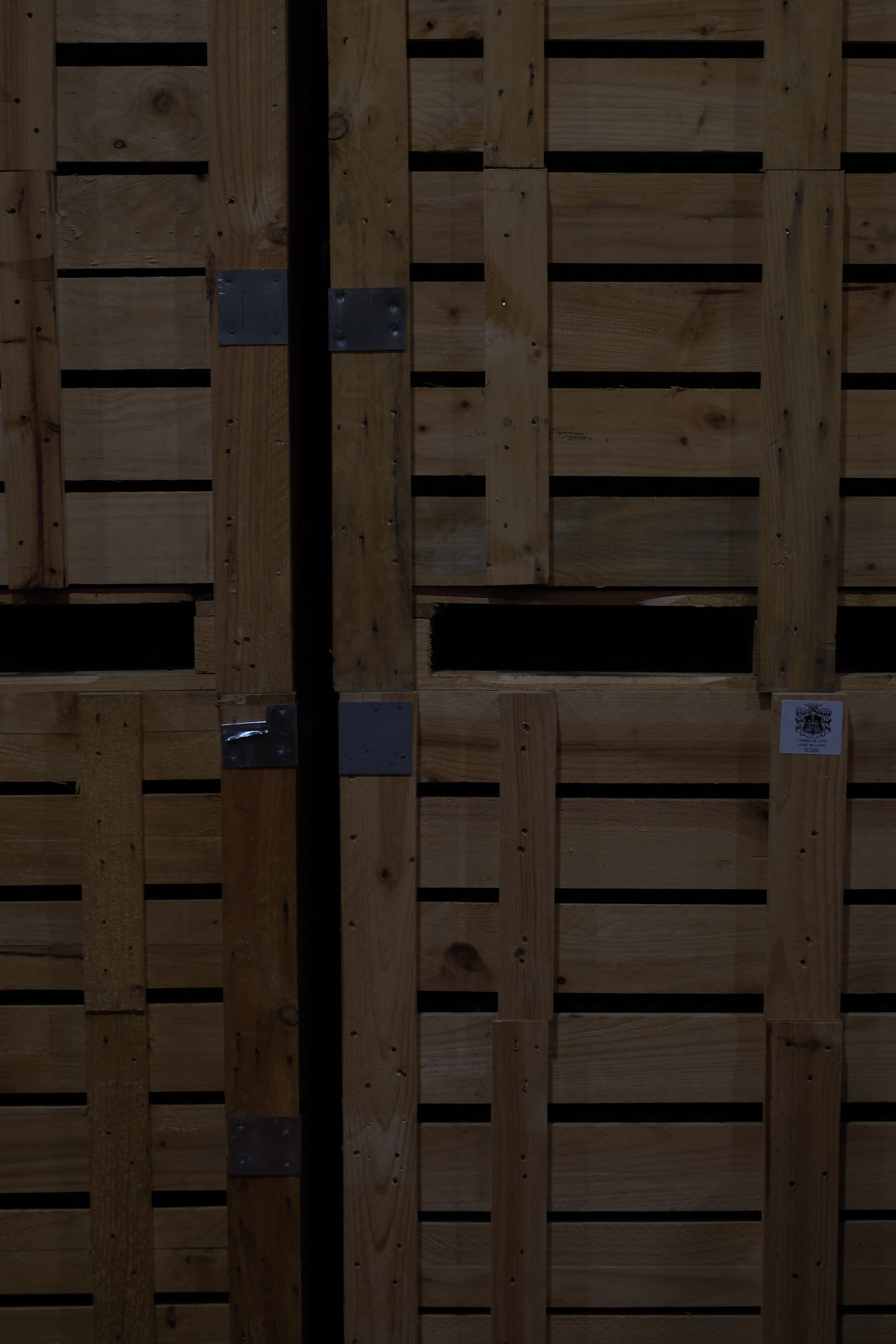 Wooden crates stacked in low light