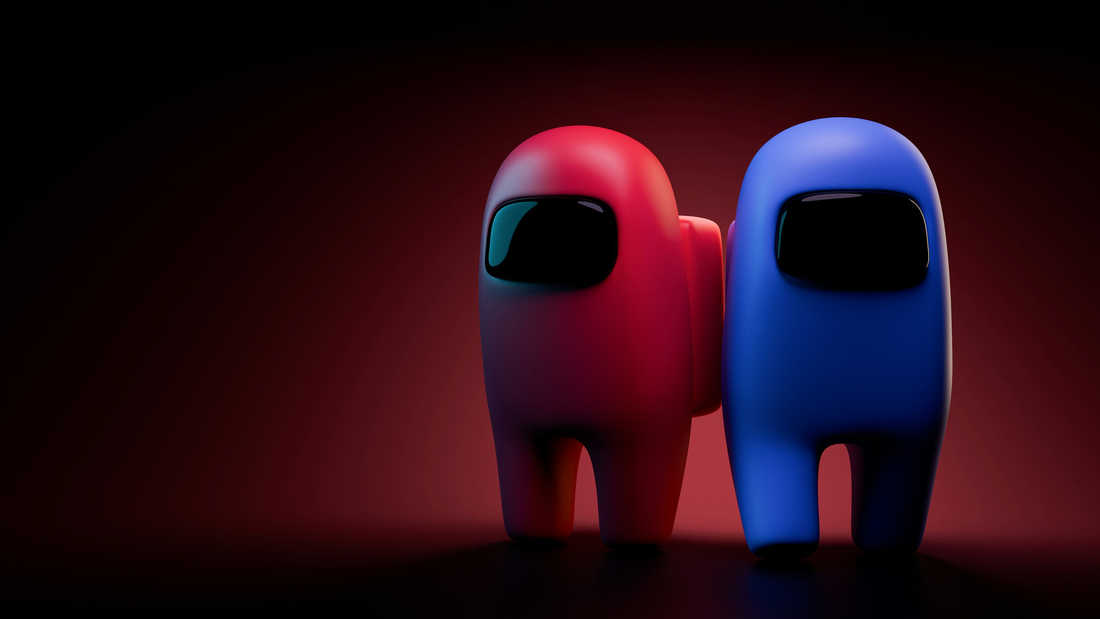Deux personnages parmi nous, rouge et bleu, se tiennent ensemble.