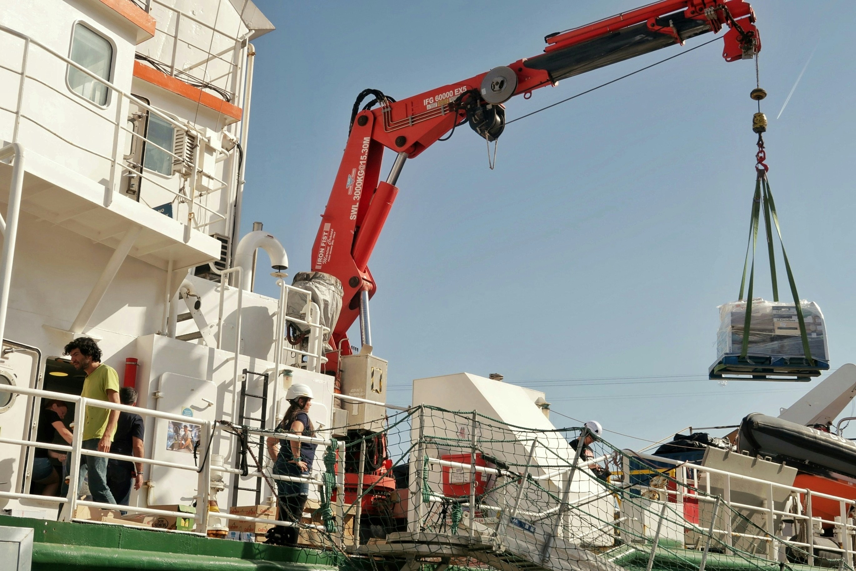 Crane loading cargo onto a ship