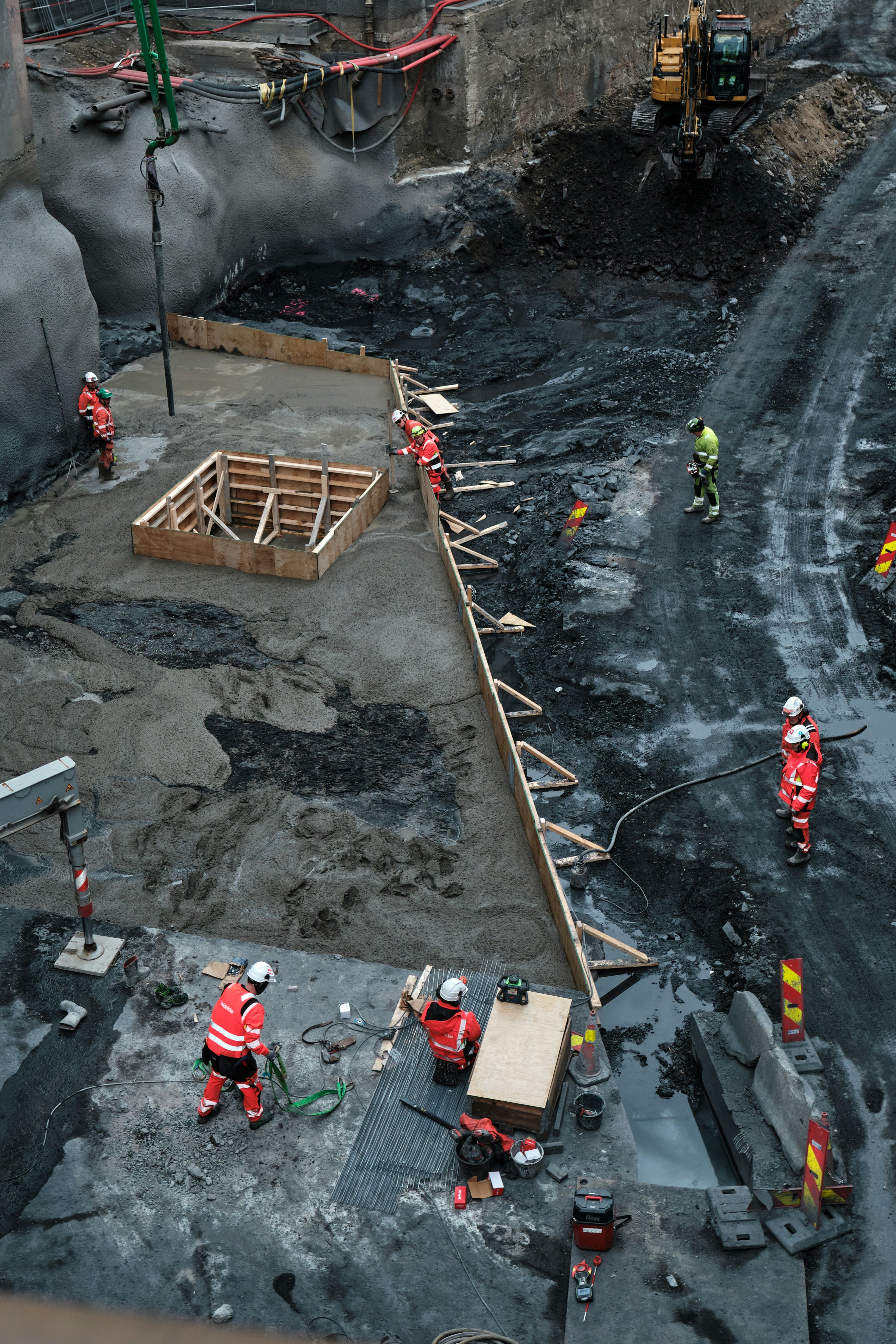Construction workers building a large foundation
