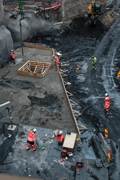 Construction workers building a large foundation
