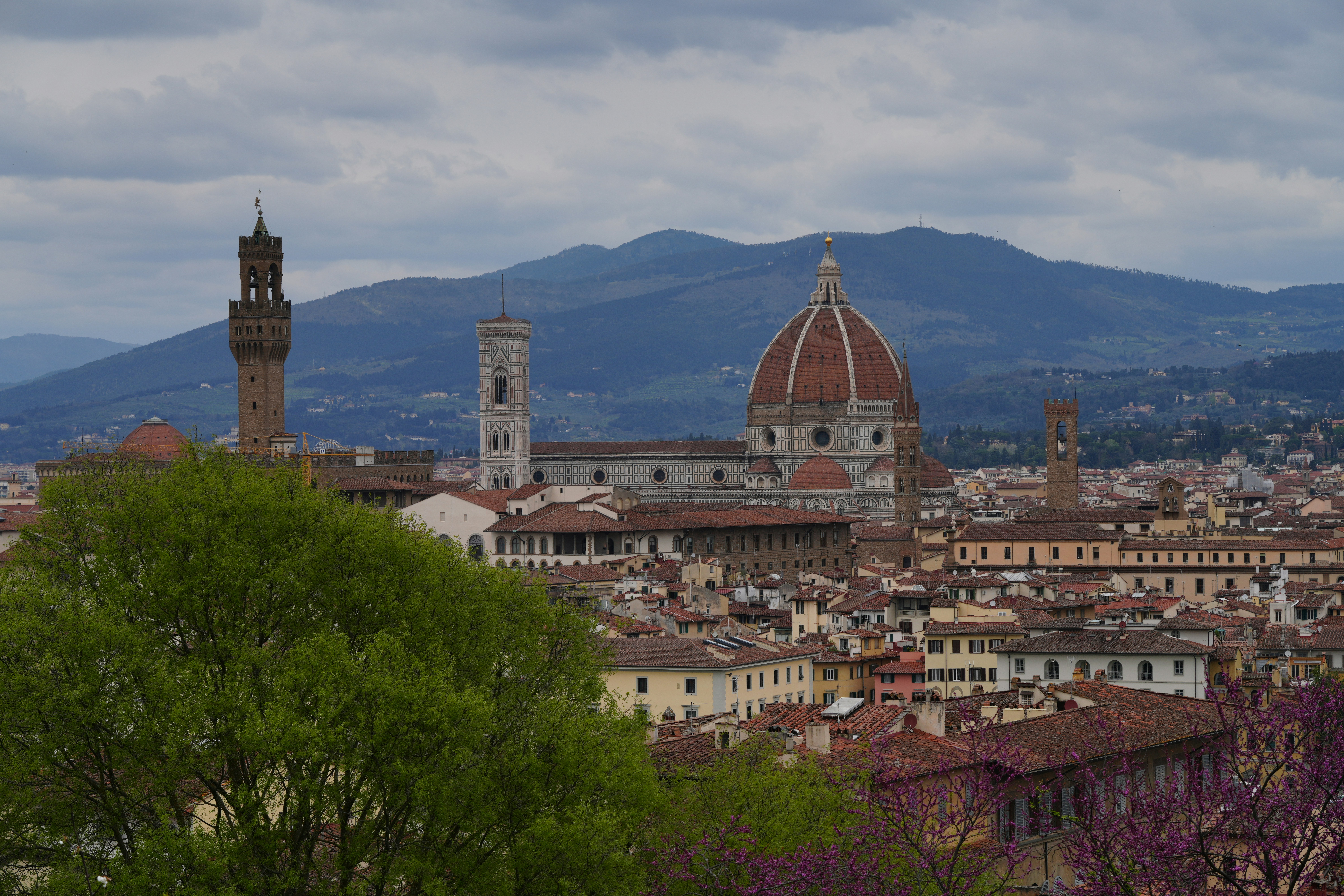 Florence cityscape with duomo and mountains in the background mountains