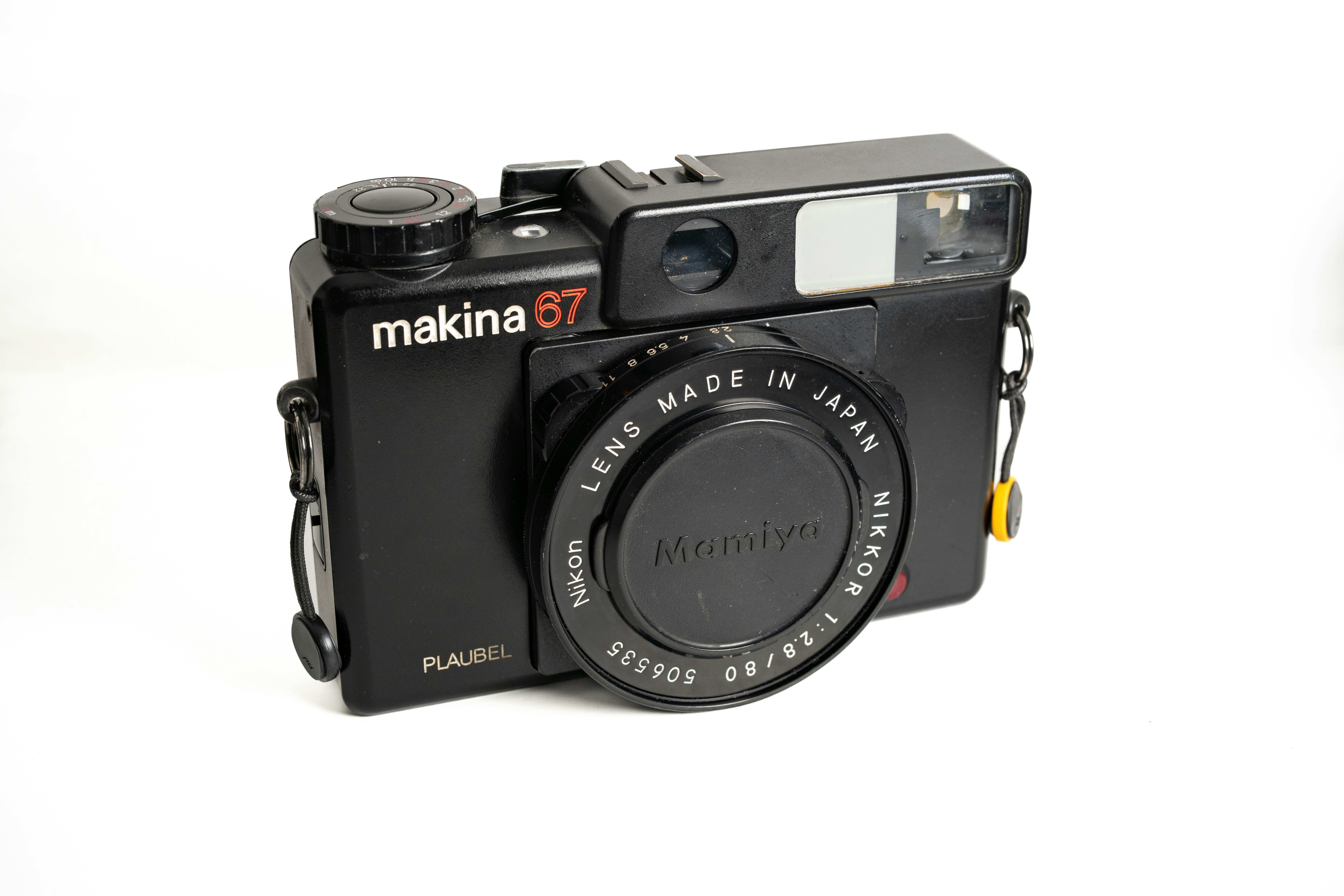 A black makina 67 camera with a lens cap.