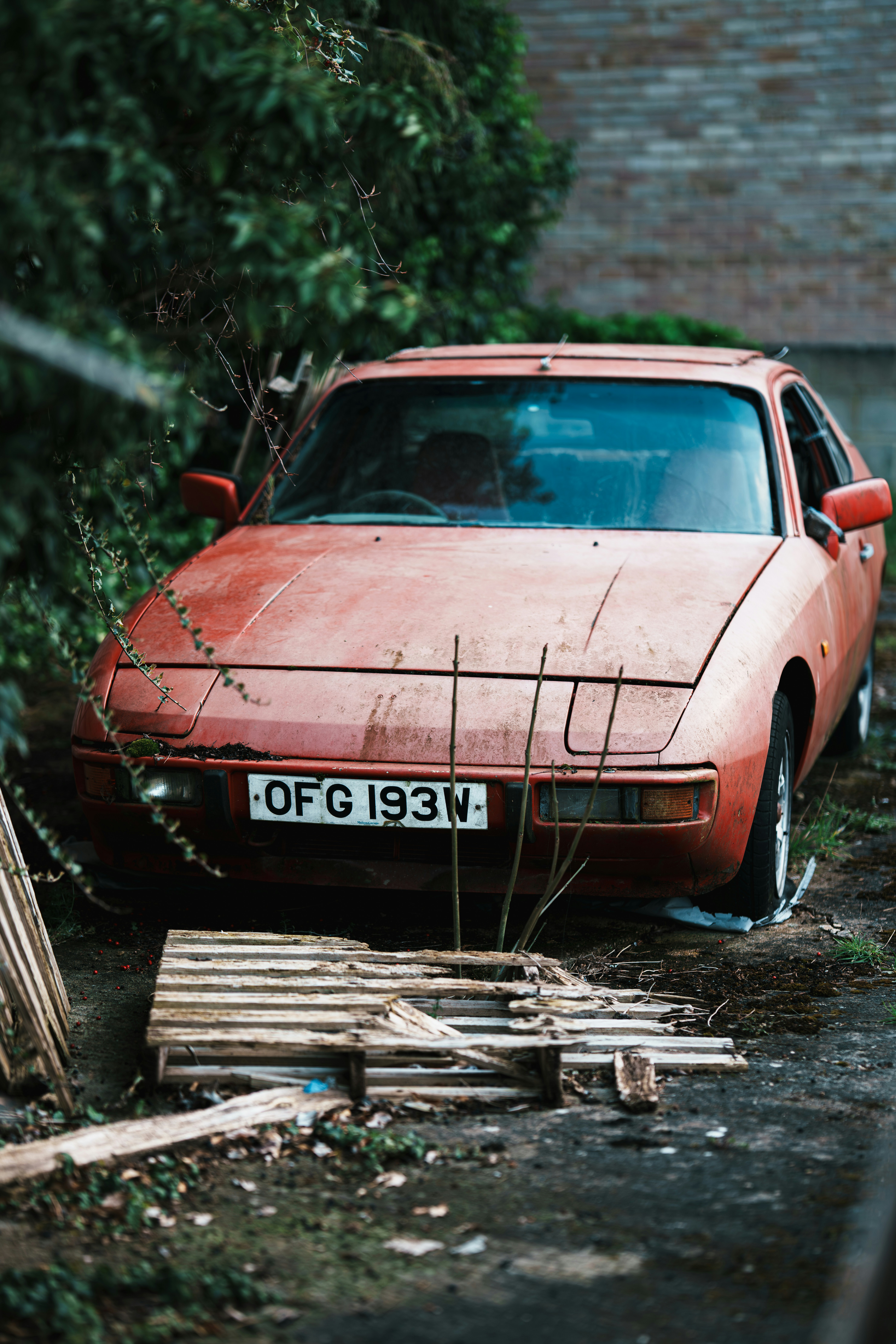 Abandoned red car with license plate ofg 193w