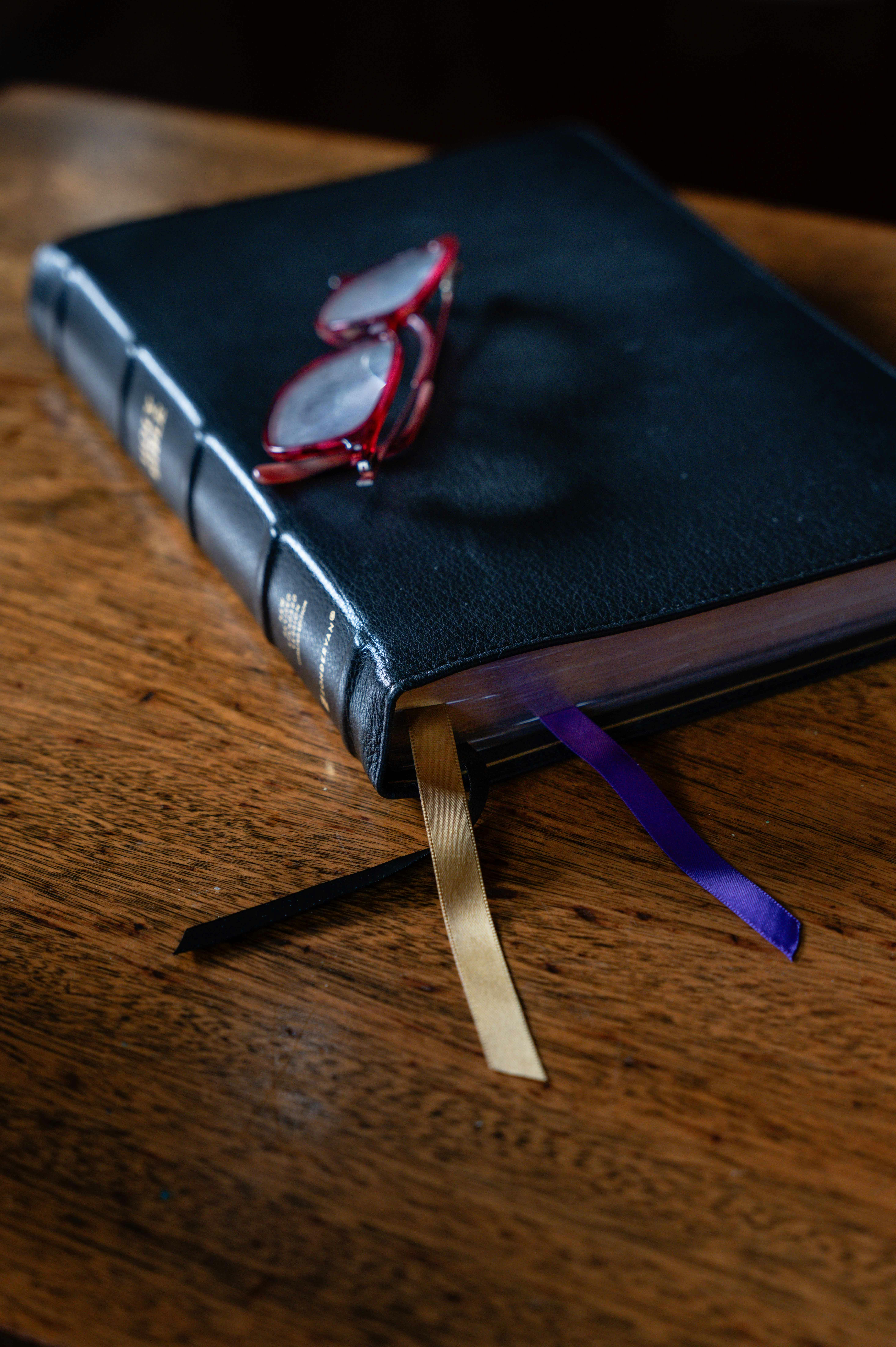Bible and glasses.