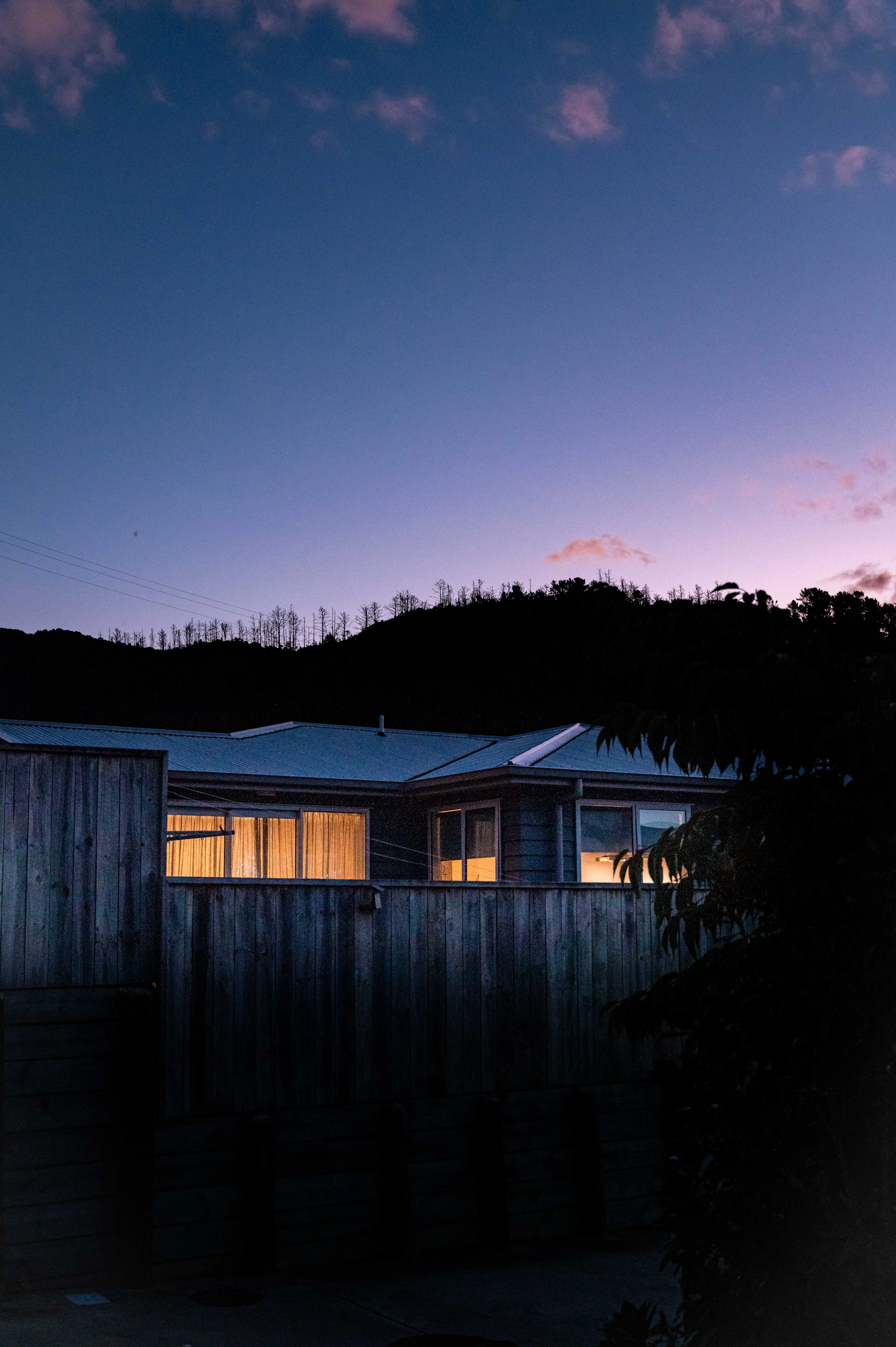 Modern home illuminated at dusk