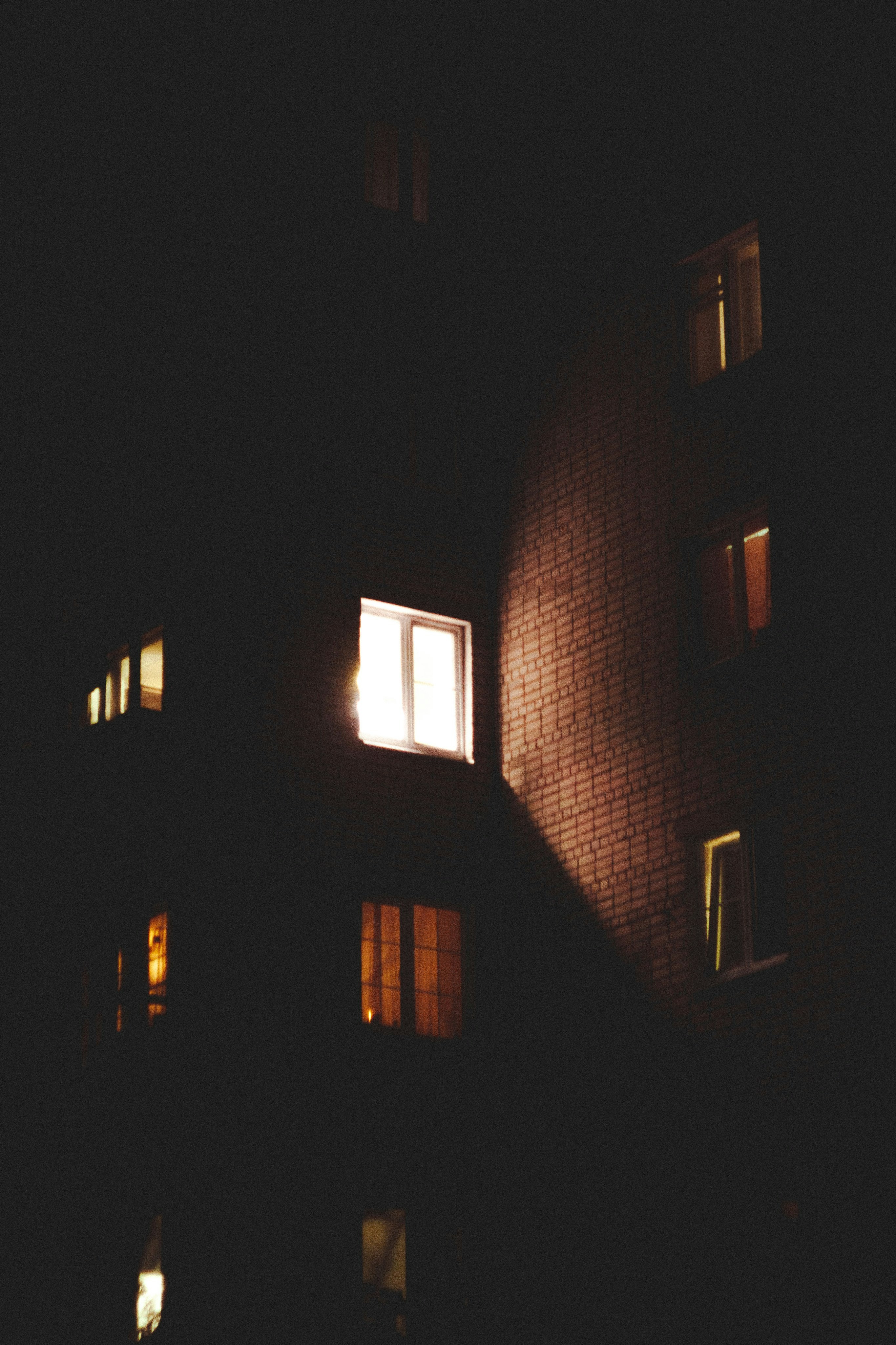 Apartment building windows glowing at night