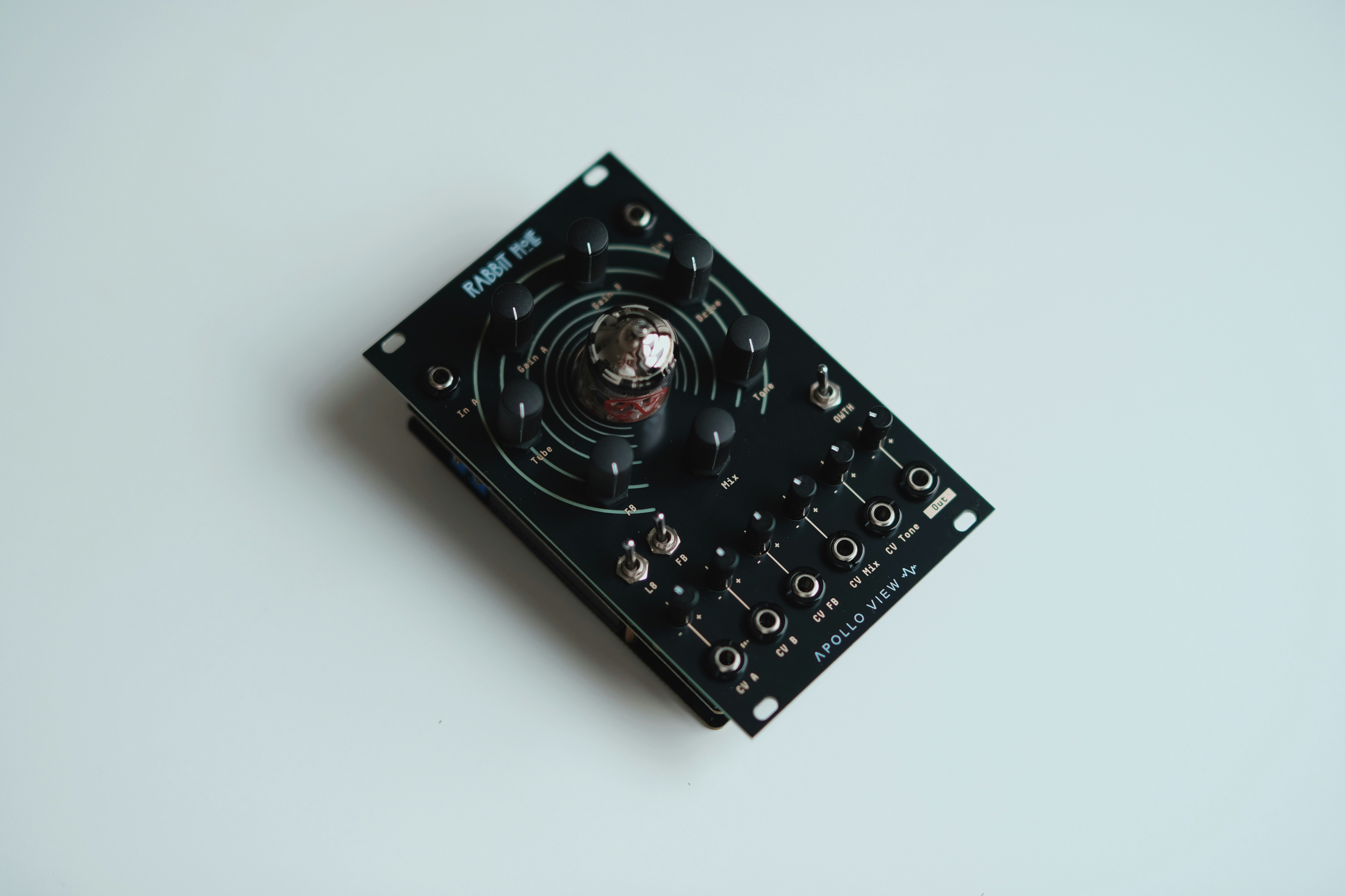 Black electronic device with a central glass tube.