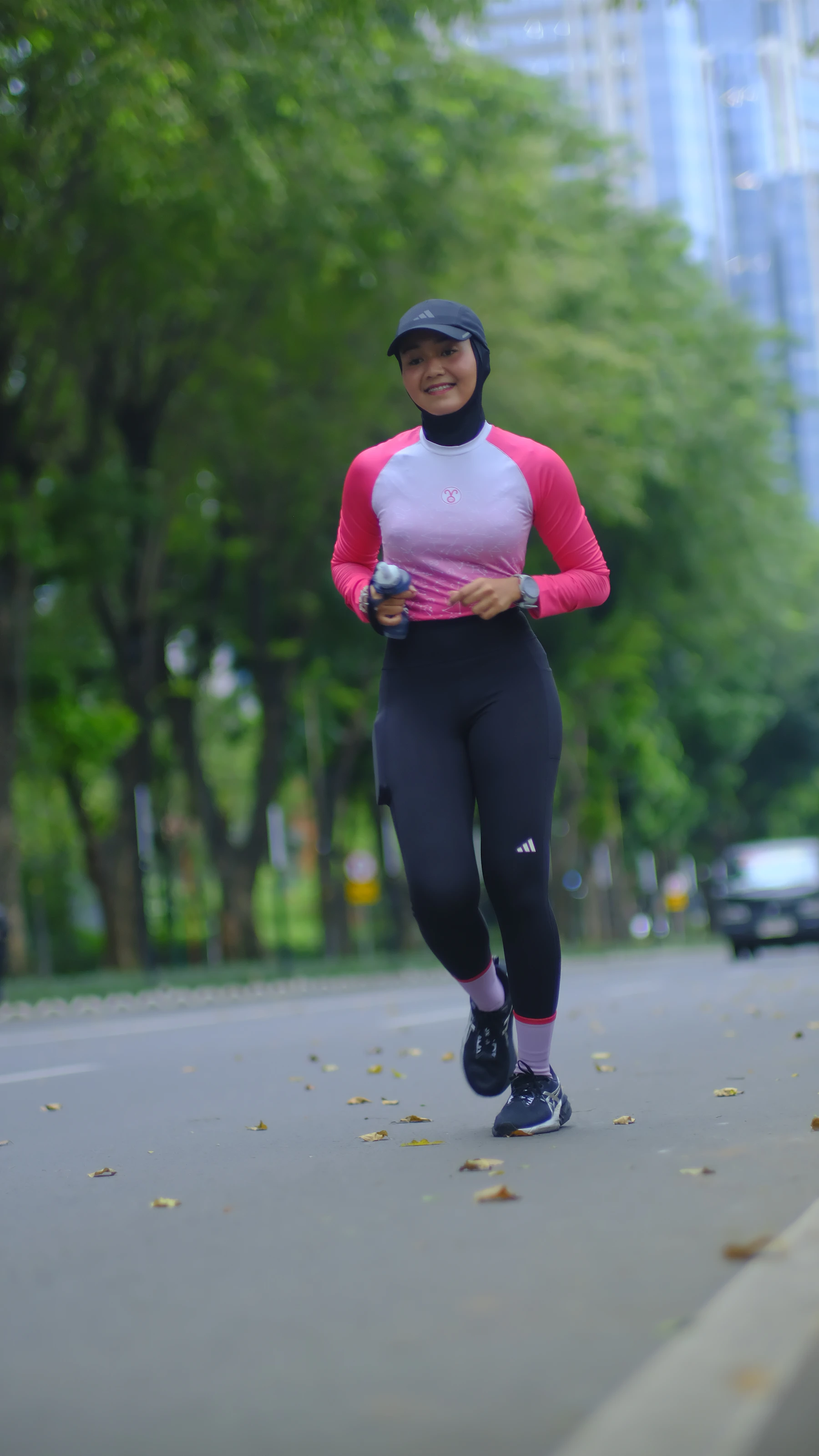 Woman running outdoors in athletic wear