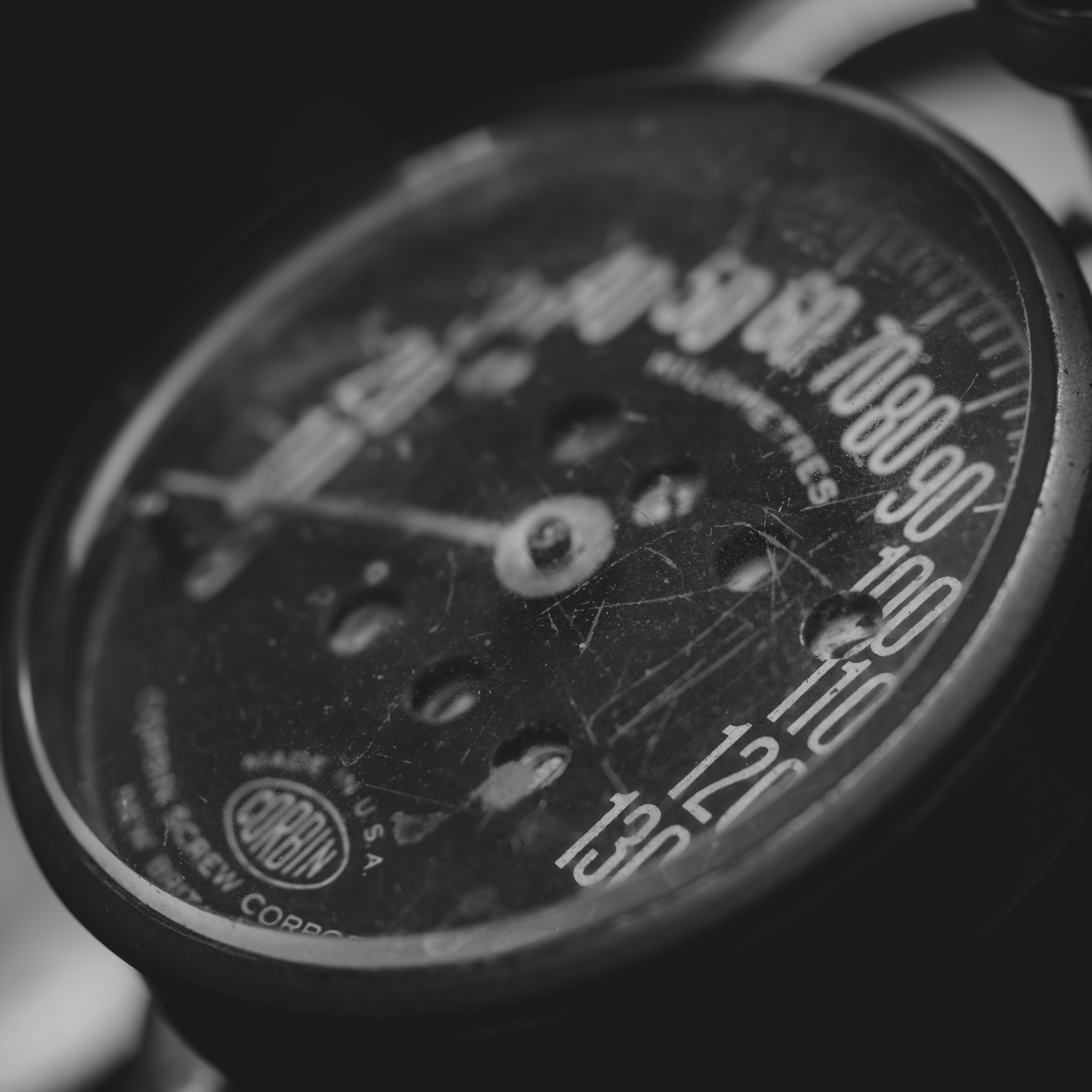 Close-up of an old motorcycle speedometer