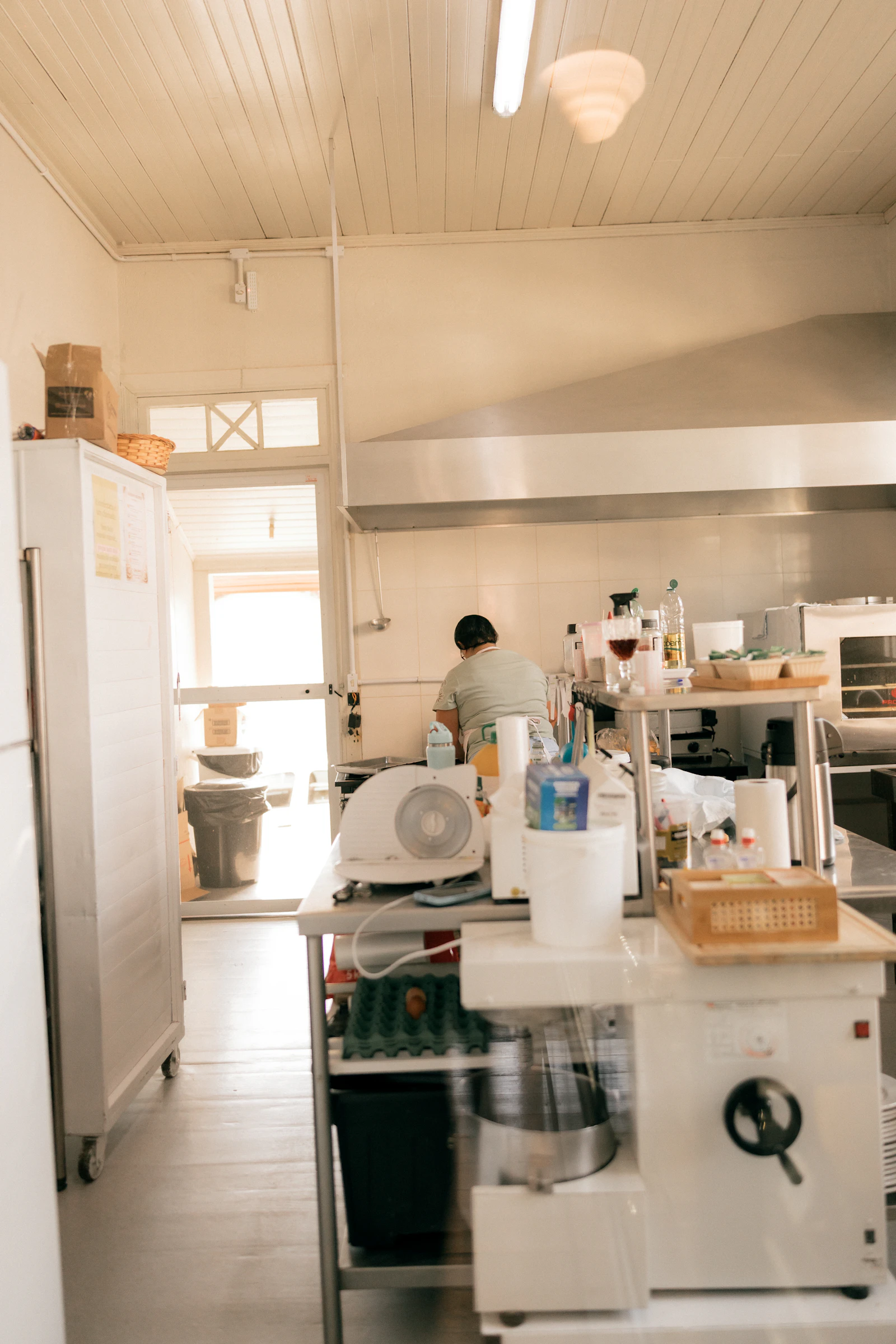 A cook working in a commercial kitchen