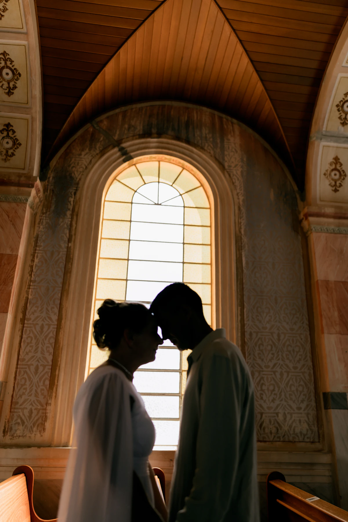 Couple silhouette by window — bedroom performance
