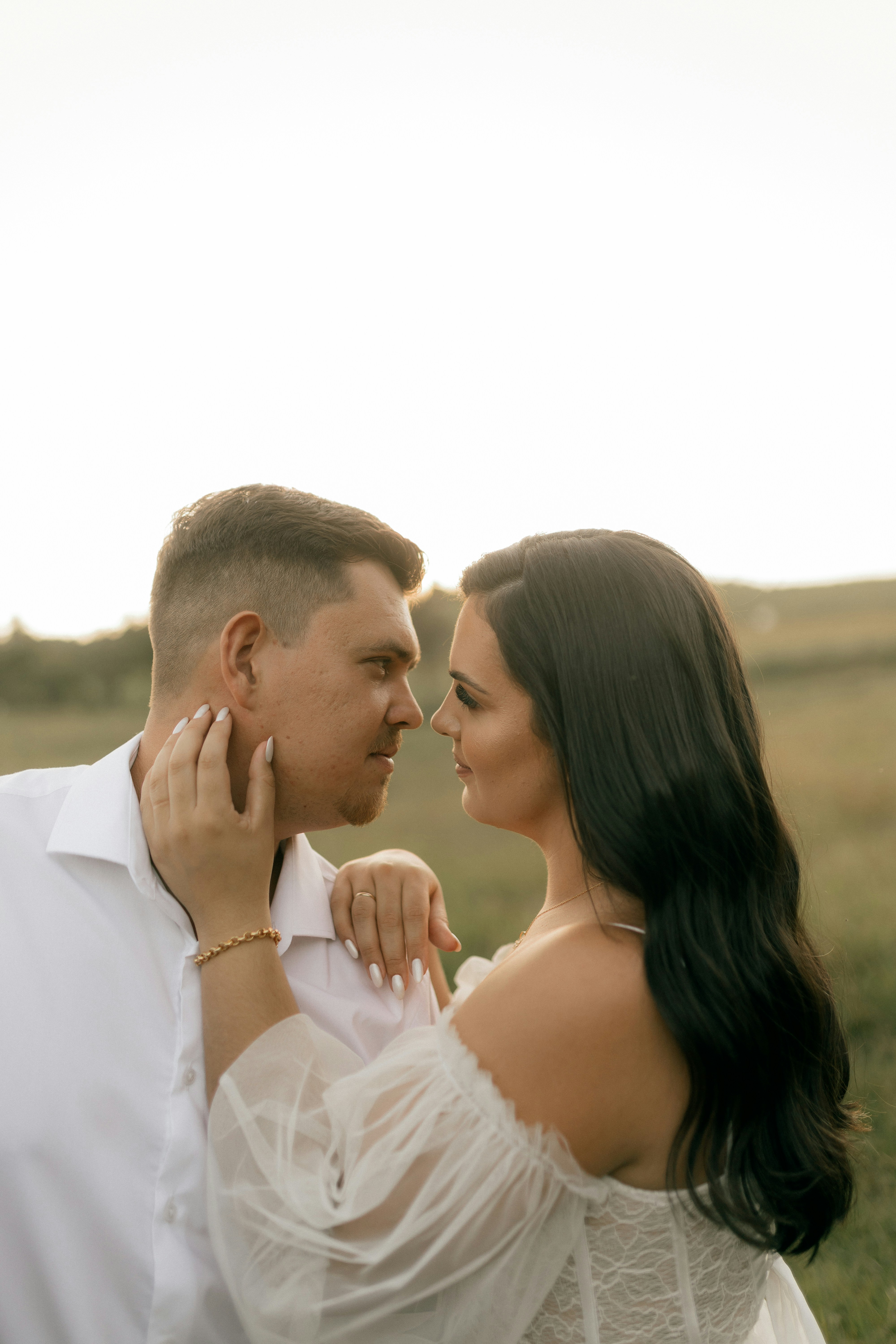 Couple looking at each other in a field