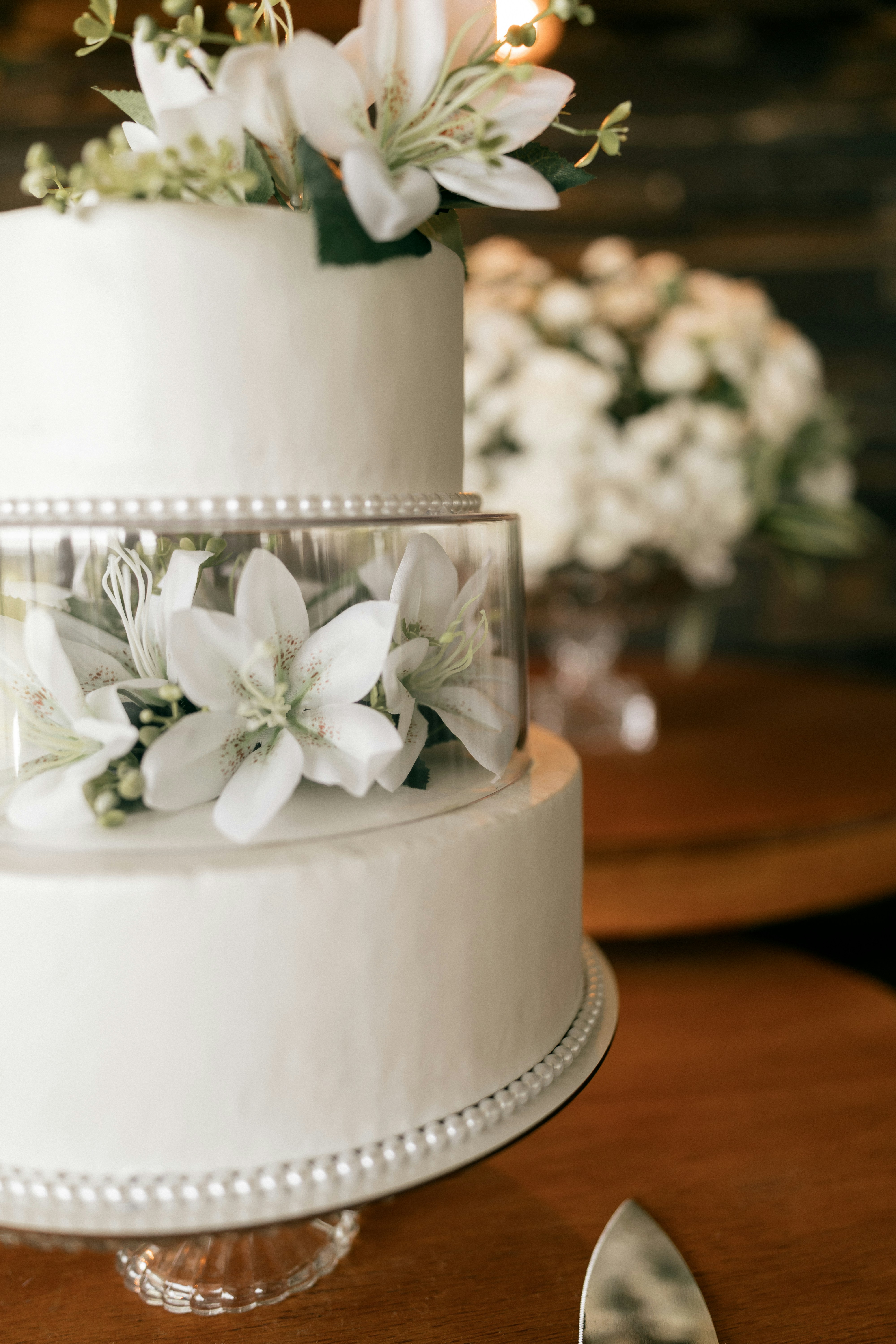 Tiered wedding cake with white florals