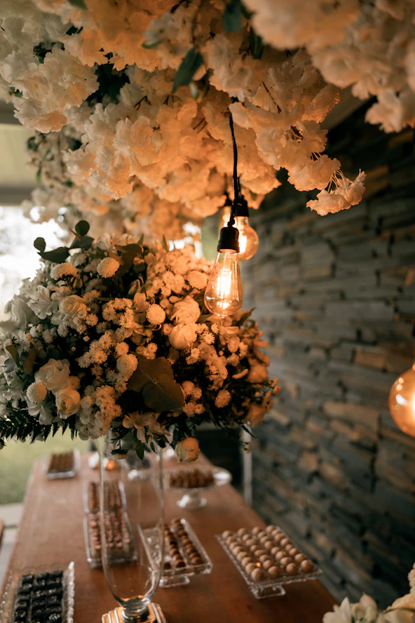 A table laden with desserts and floral arrangements