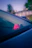 A small pink octopus sits on a car dashboard.