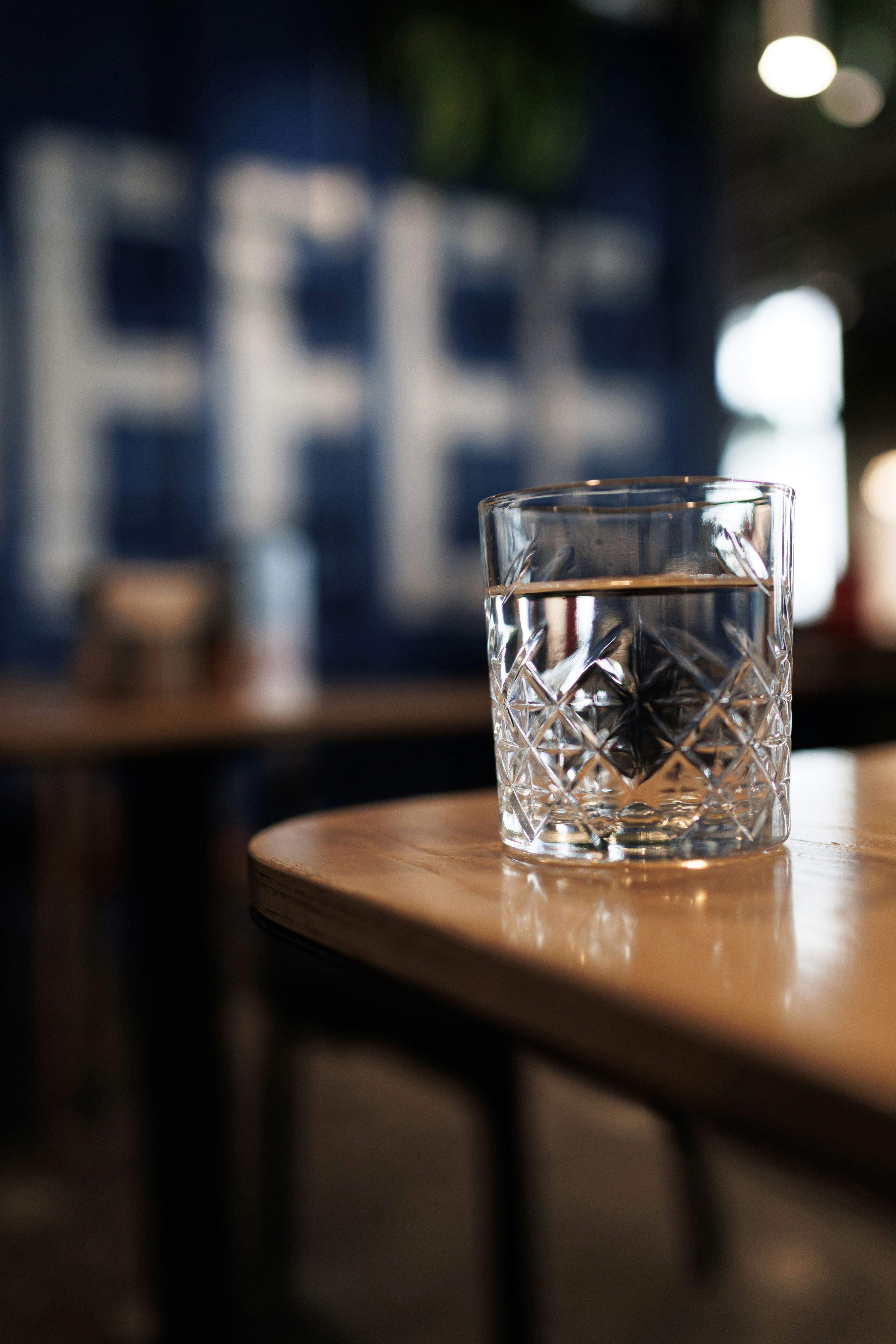 A glass of water on a wooden table
