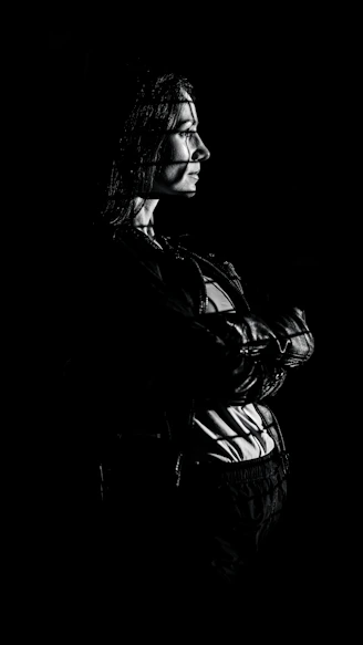Woman with patterned light on her face and body.