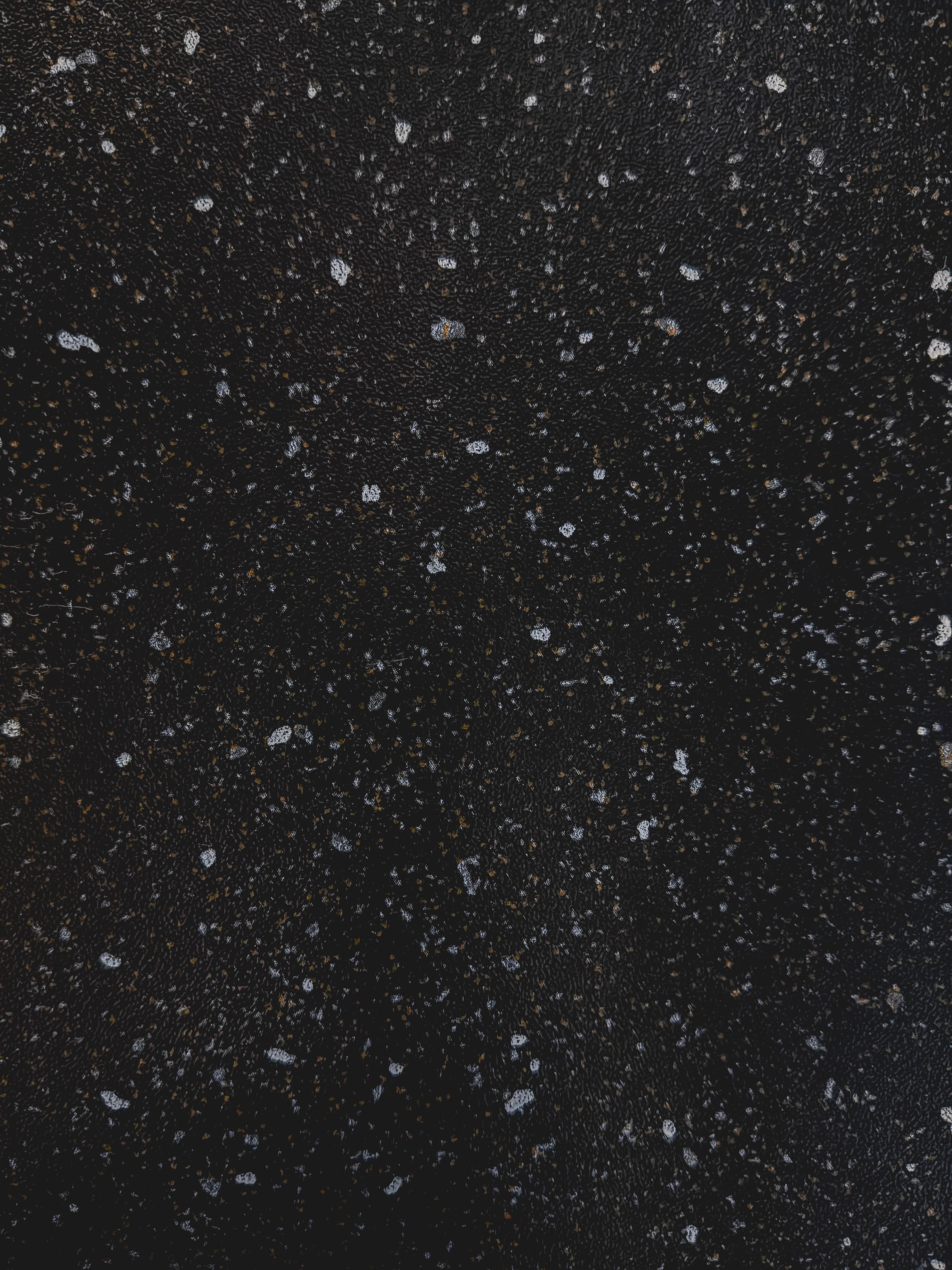 Representative photo: black stone with scattered light specks