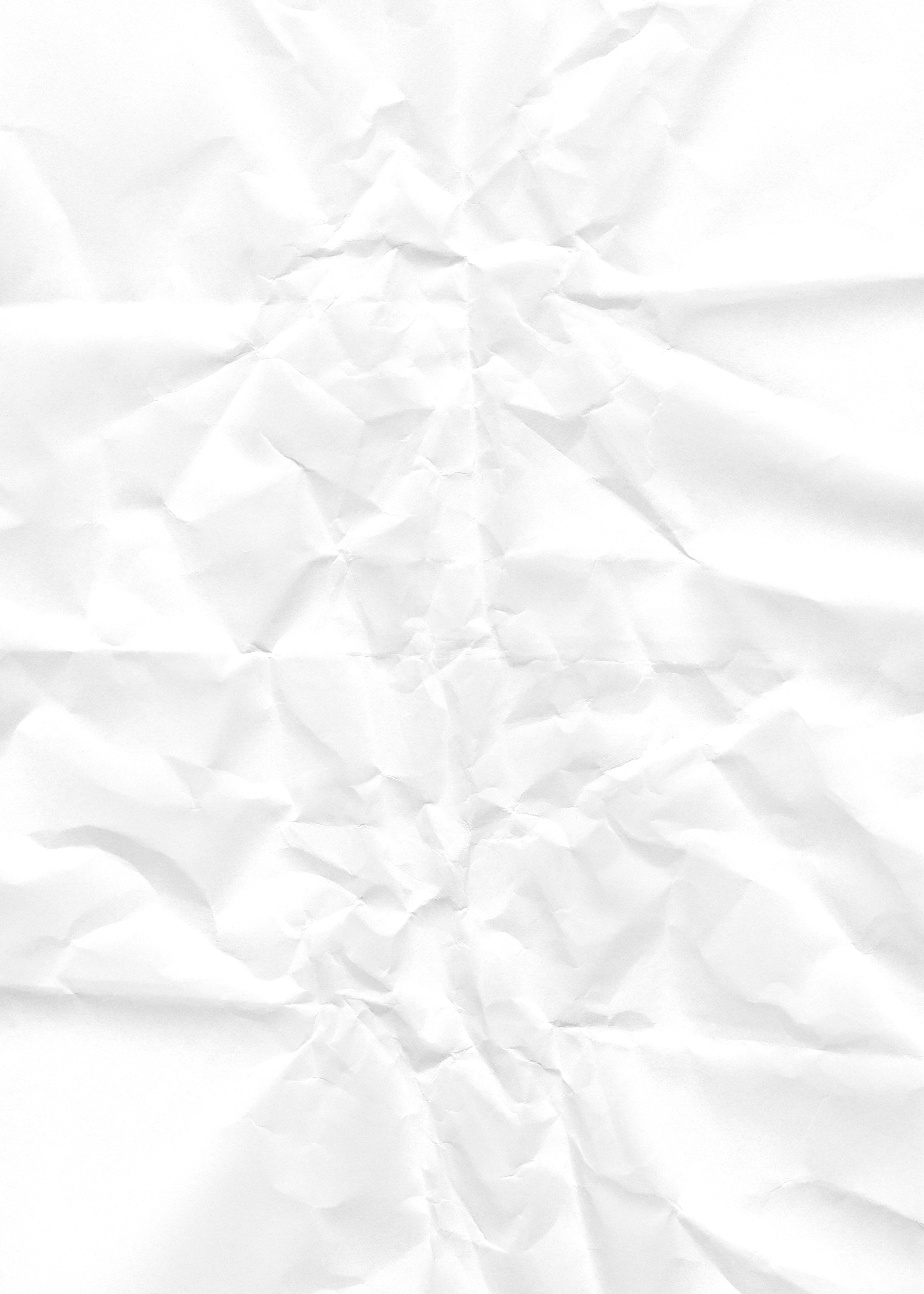 Crumpled white paper with texture and shadows