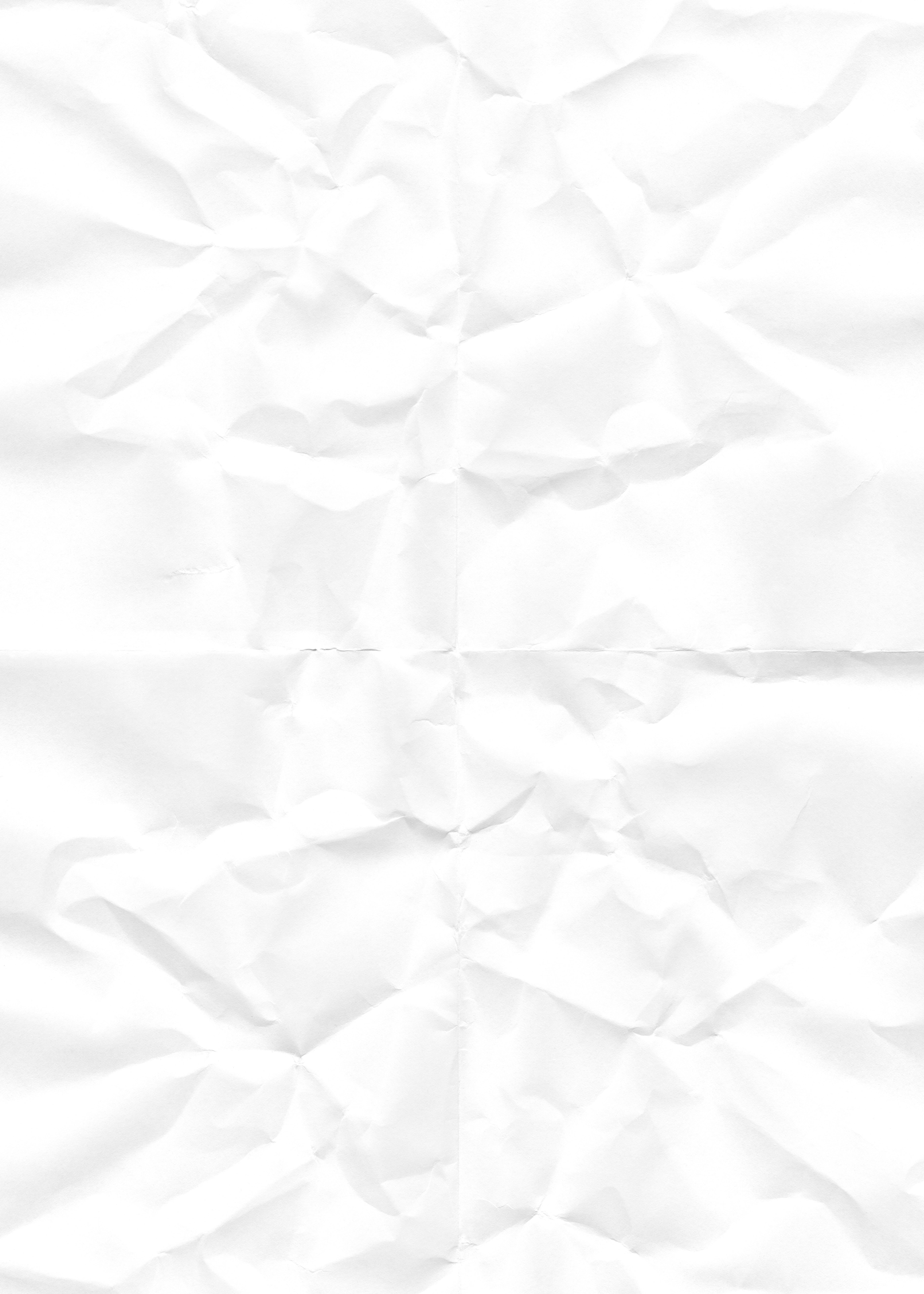 A white crumpled paper background with visible texture