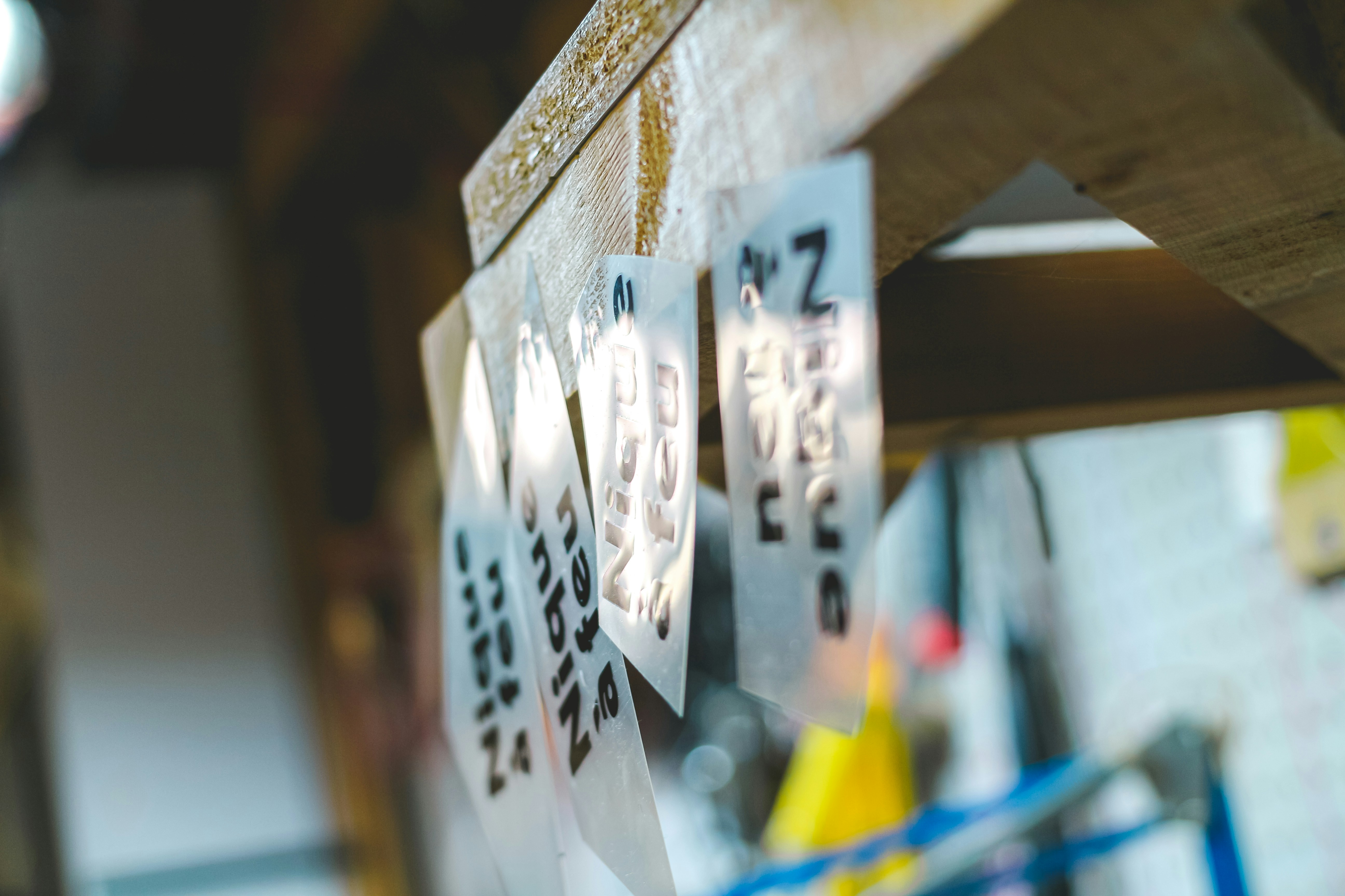 Several clear plastic sheets with black text hanging