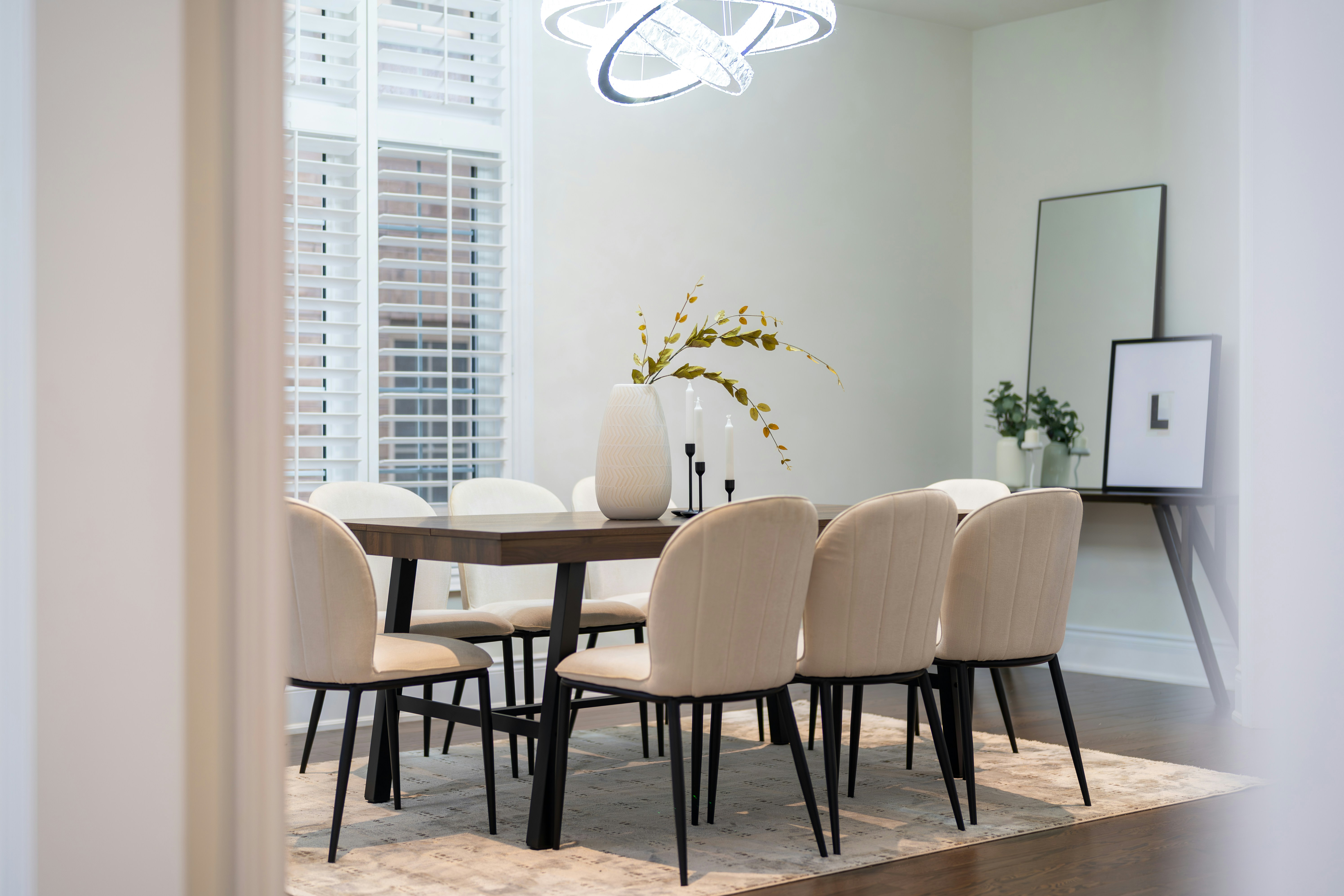 Elegant dining room with a large table and chairs.