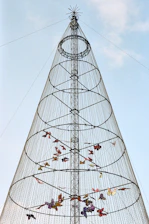 Tall illuminated christmas tree with colorful ornaments