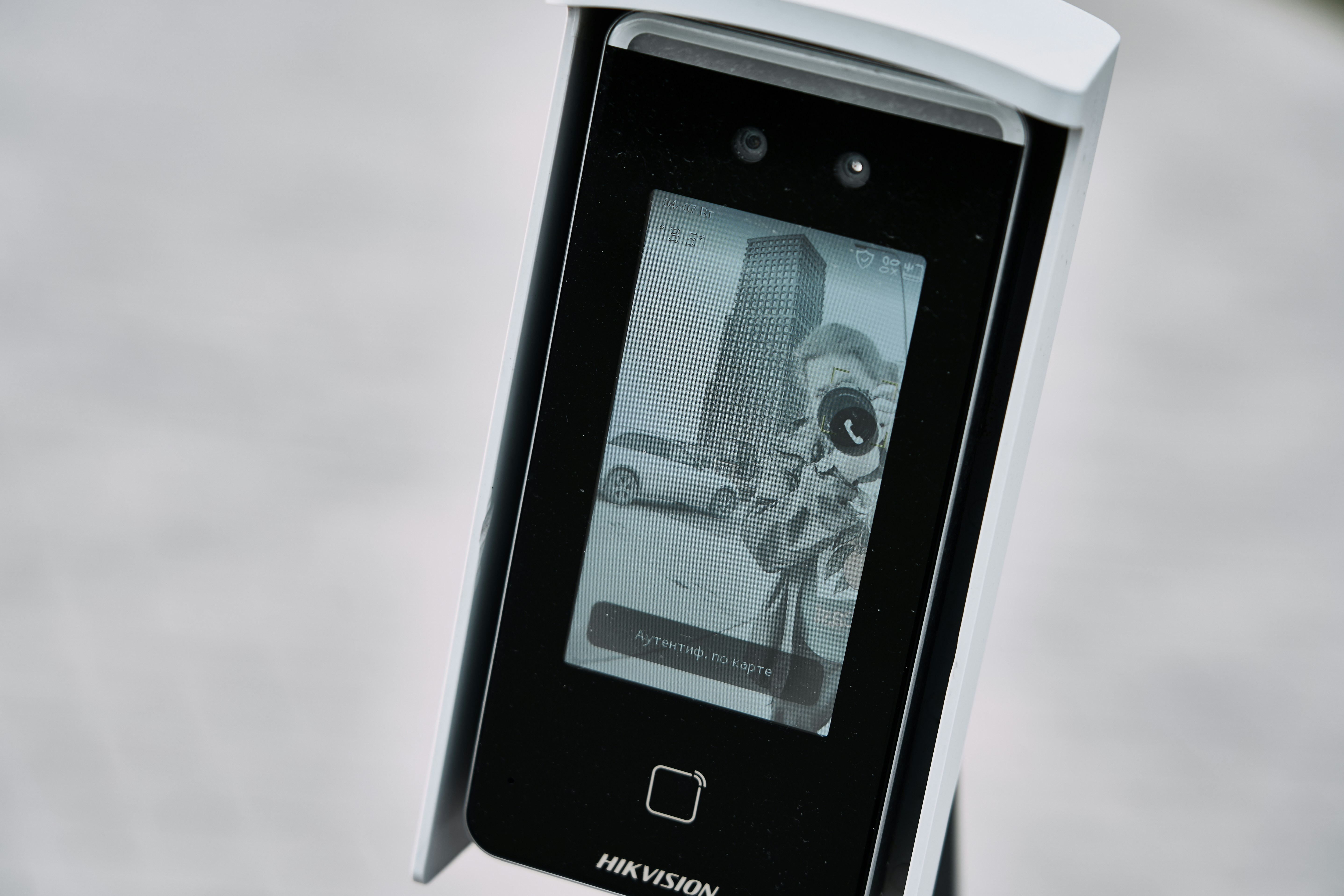 Facial recognition device displaying a black and white image.