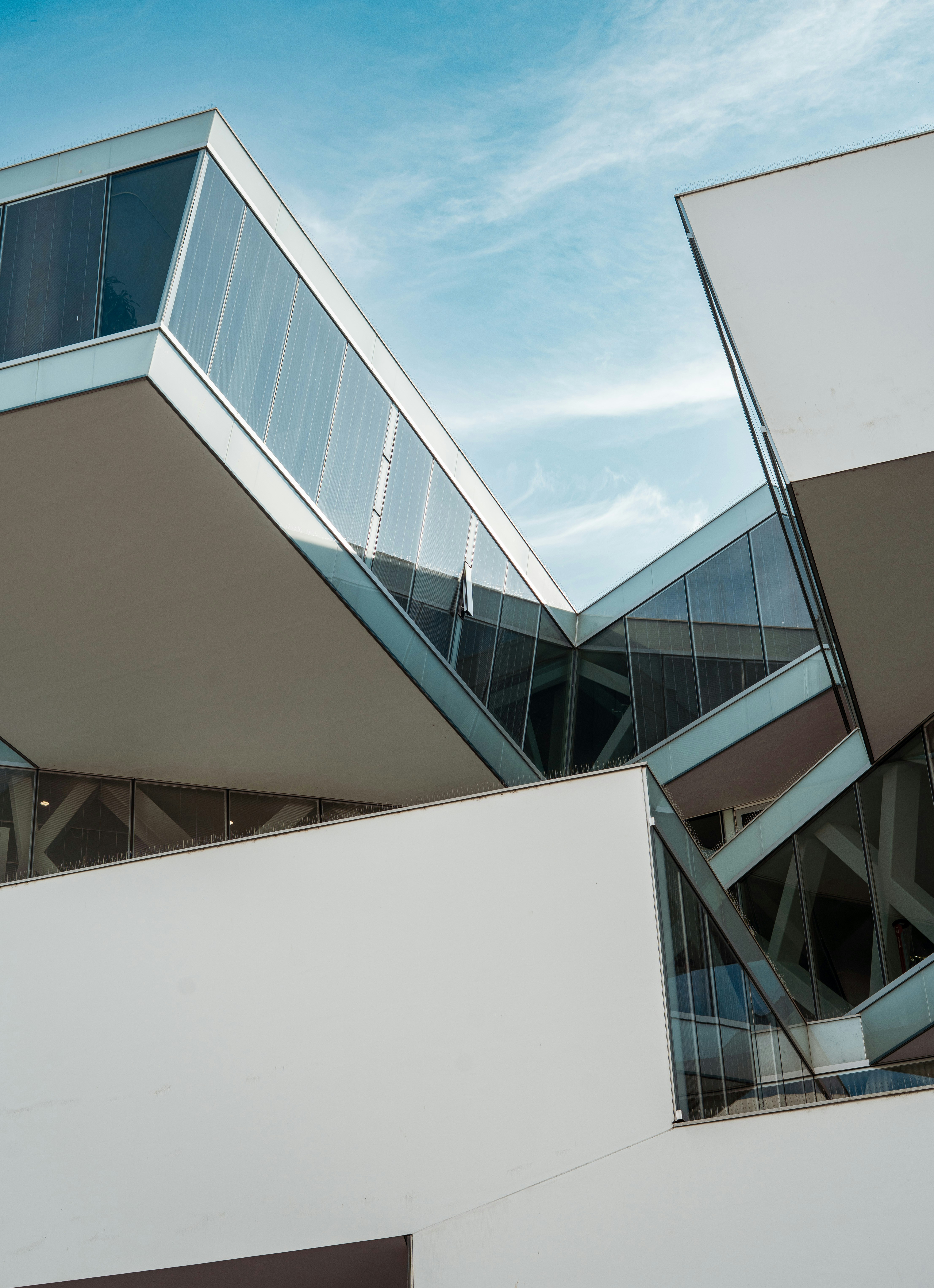 Modern architecture with sharp angles against blue sky