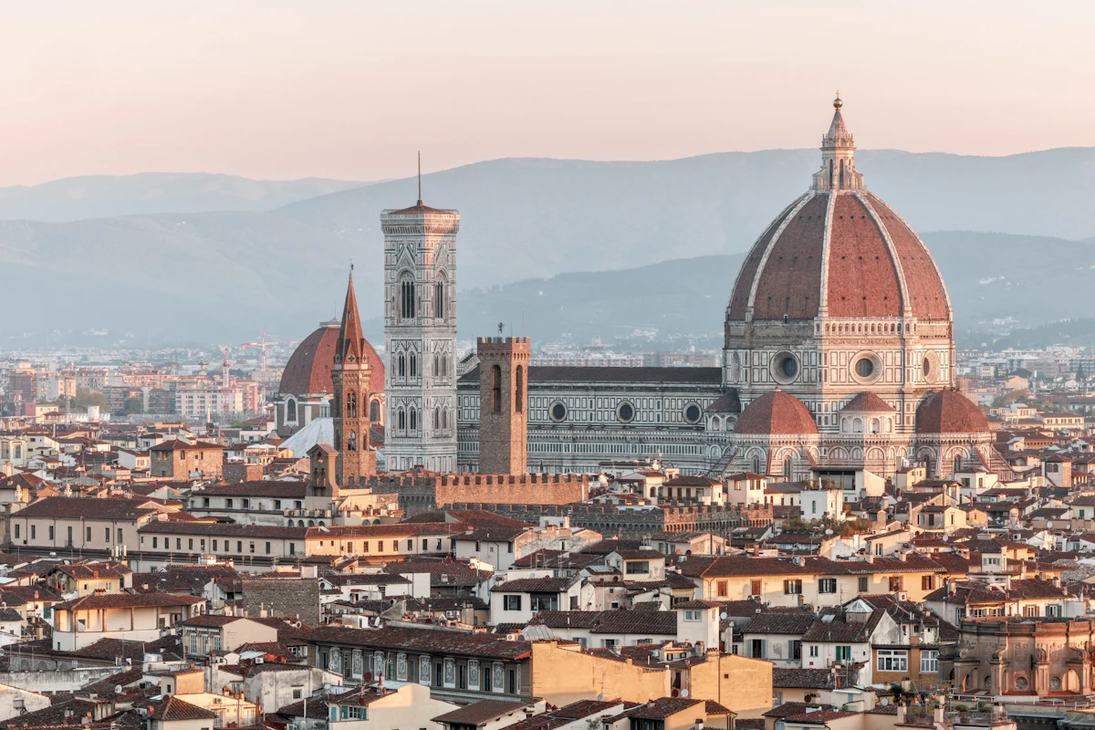 Florence rooftops and the Cathedral of Santa Maria del Fiore at sunrise