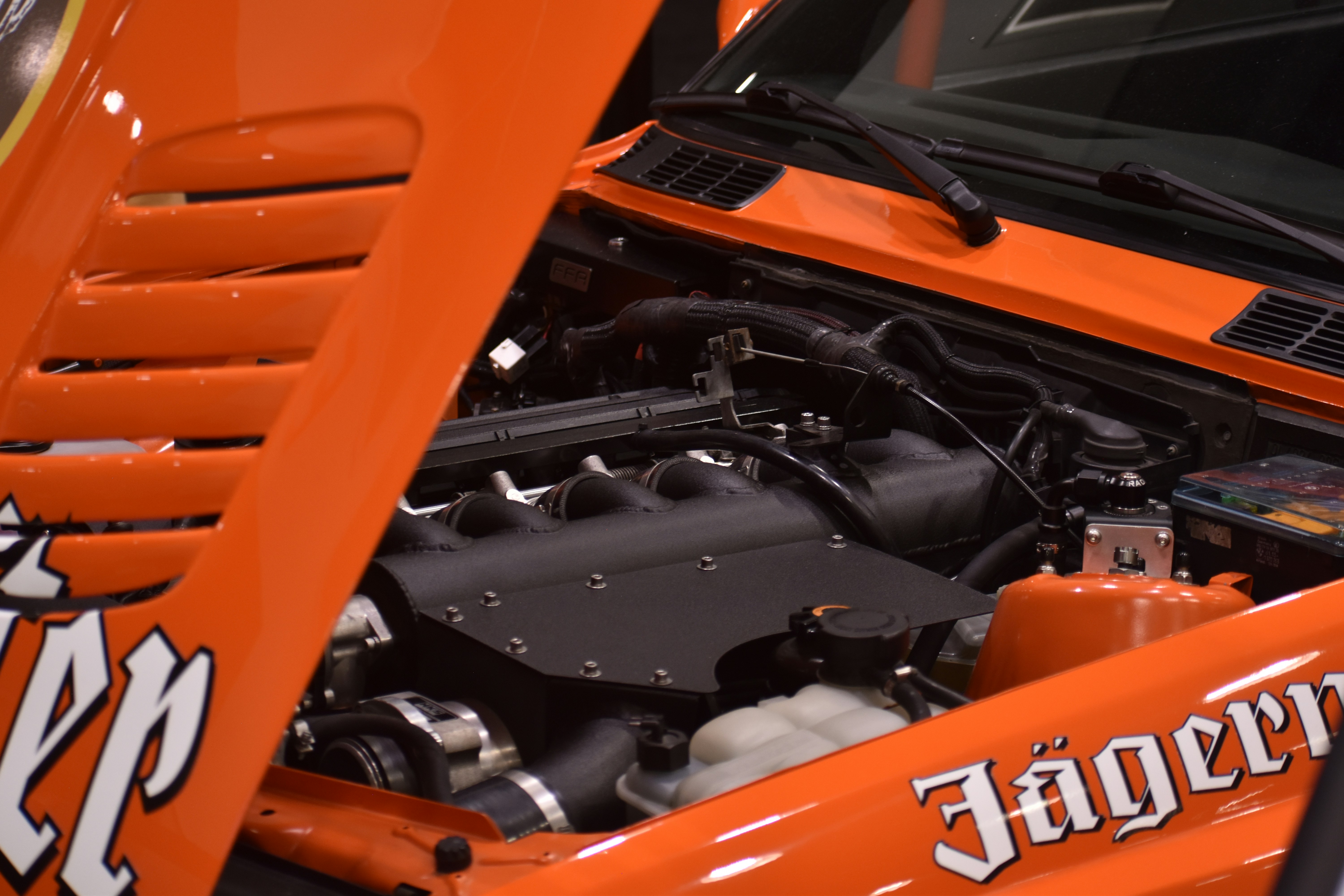 Orange car engine with jägermeister logos