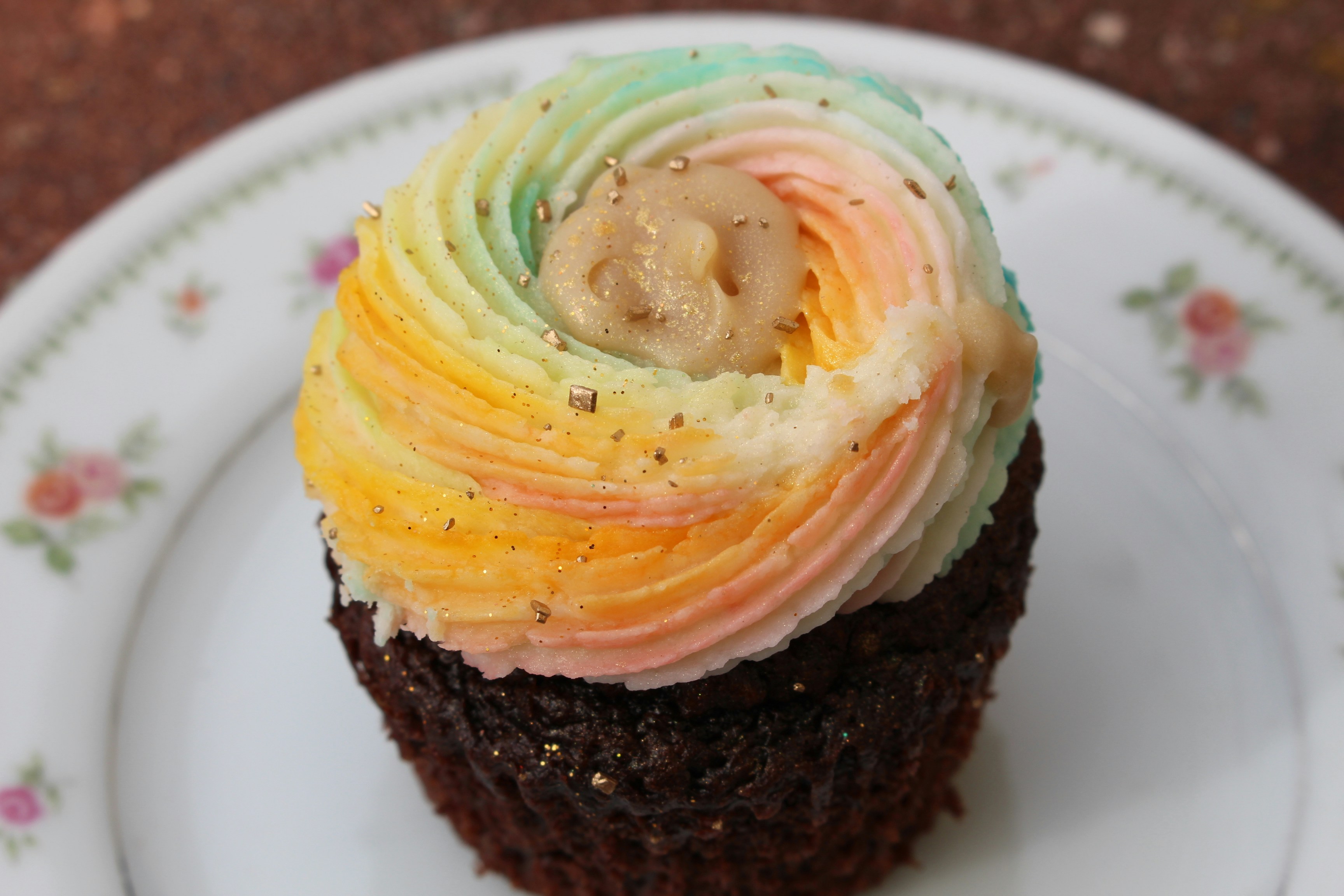 Chocolate cupcake with rainbow swirl frosting