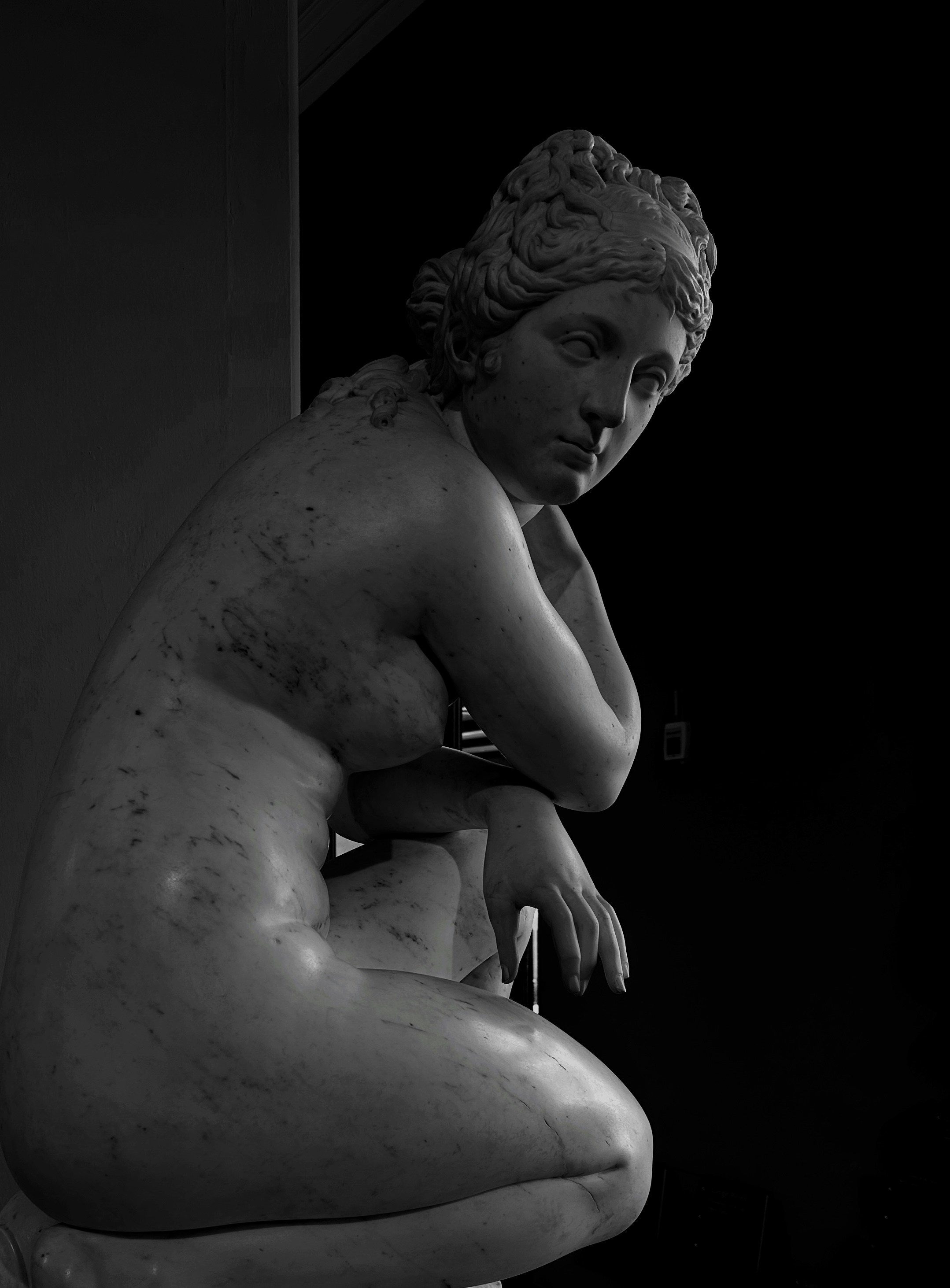 Marble statue of a reclining nude woman