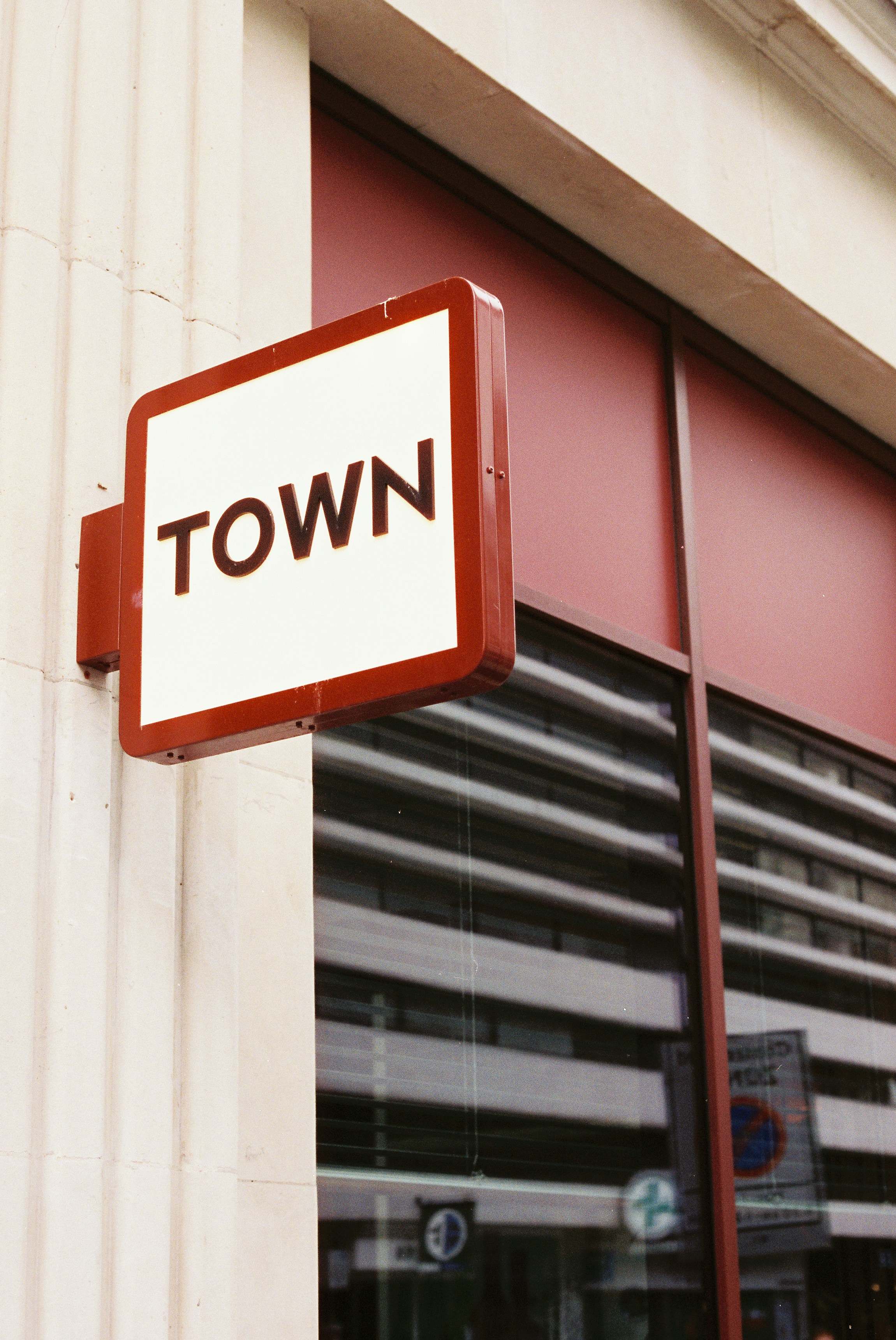 A square sign with the word town photo – Free Building Image on Unsplash