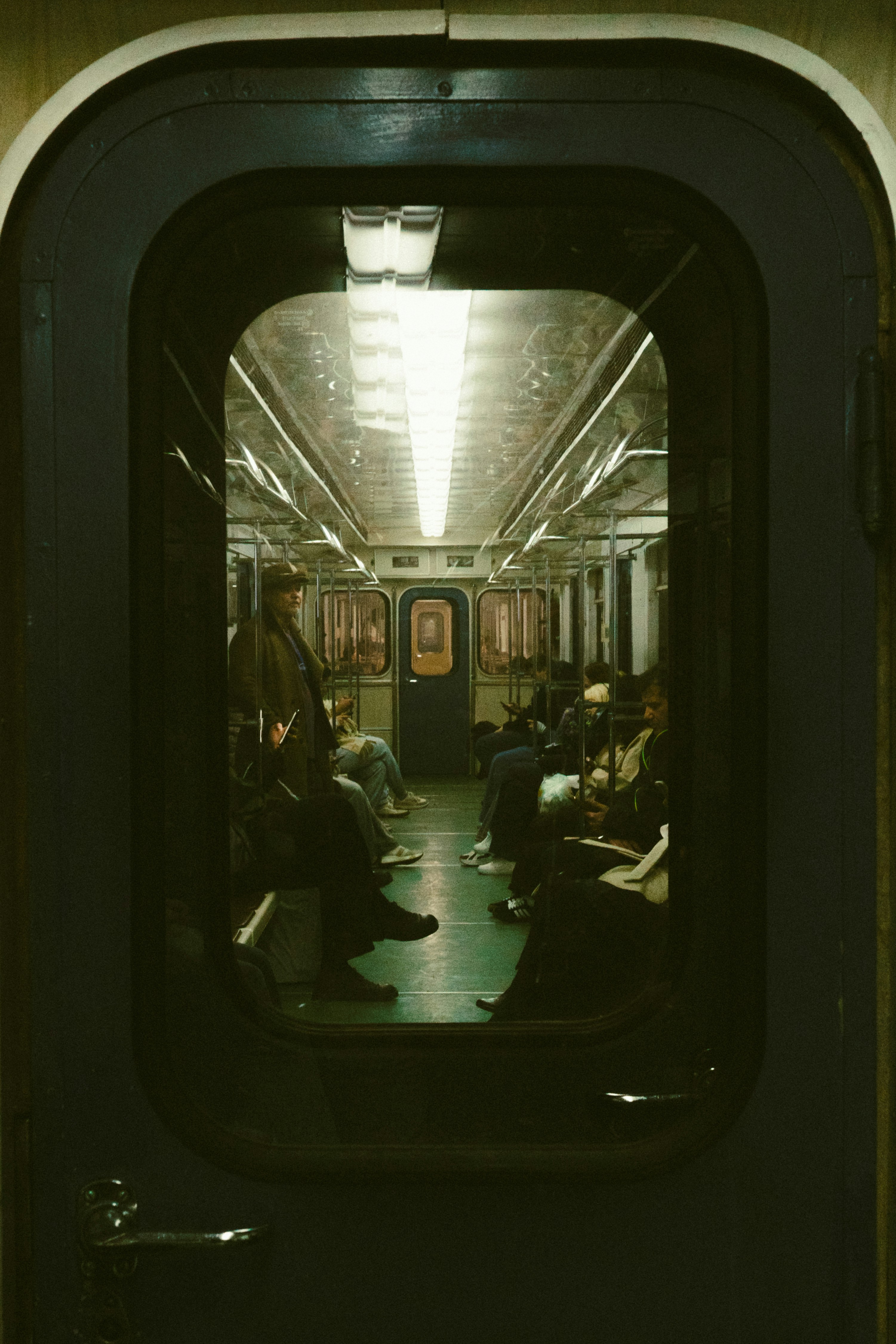 People sitting inside a subway car
