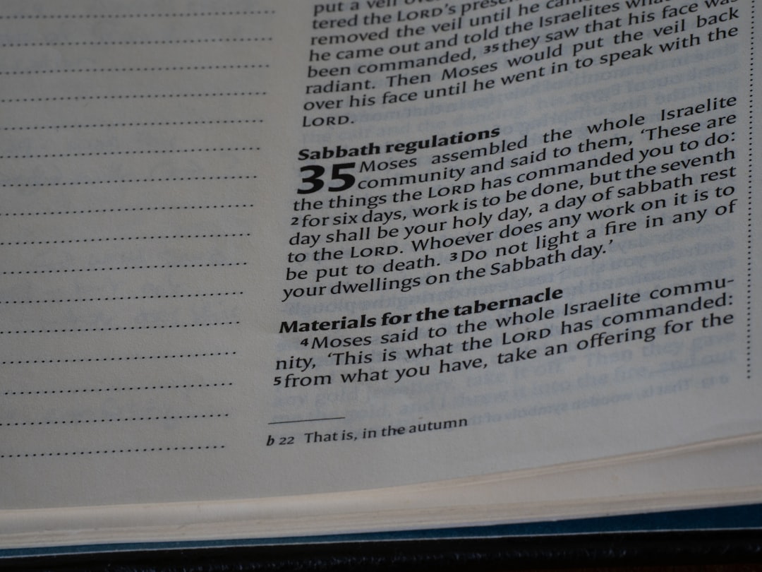 Close-up of an open bible with text visible